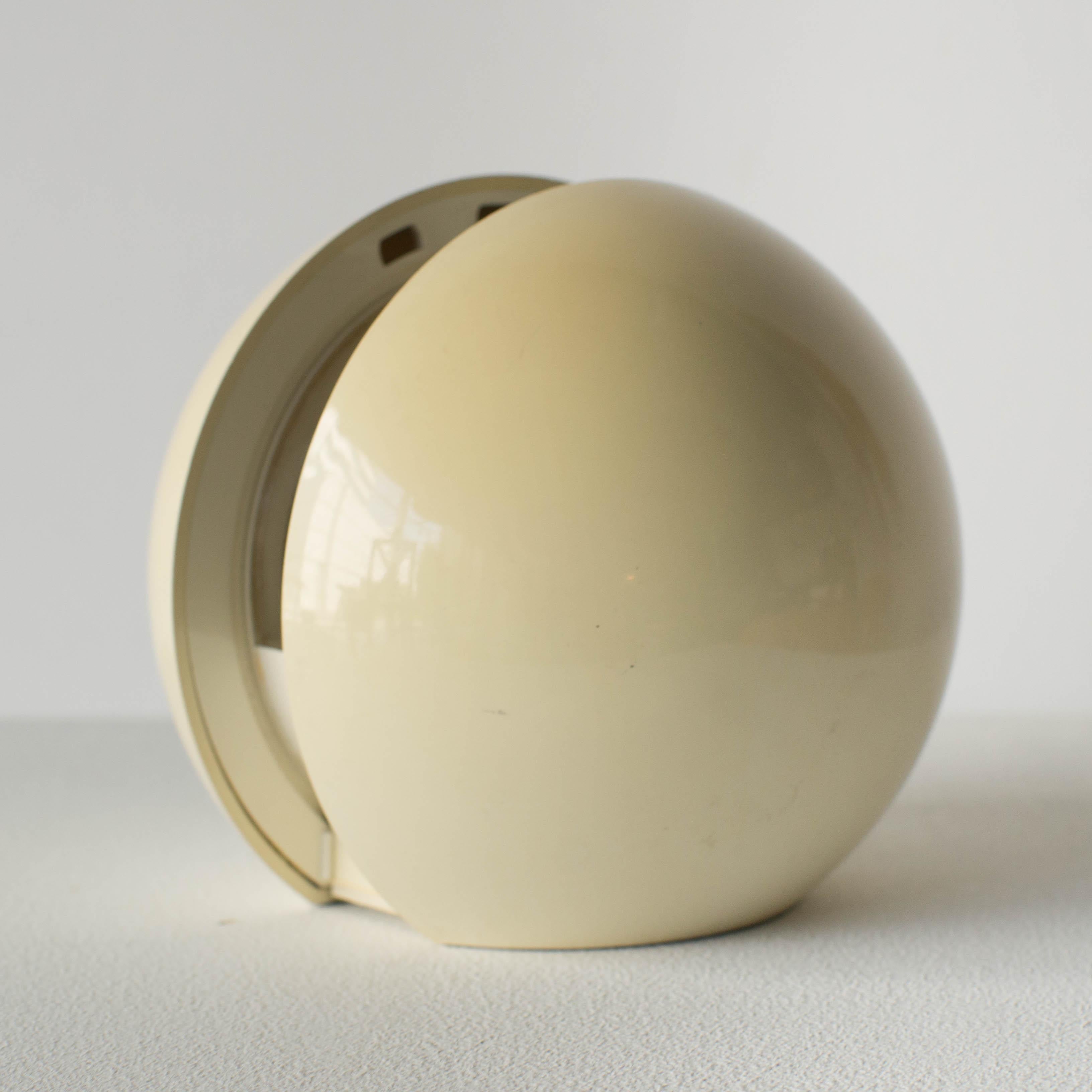 Gea lamp by Italian artist Gianni Colombo for Arredoluce.
There is a shade to adjust light at the centre of the ball. White color, a little sunned.
 