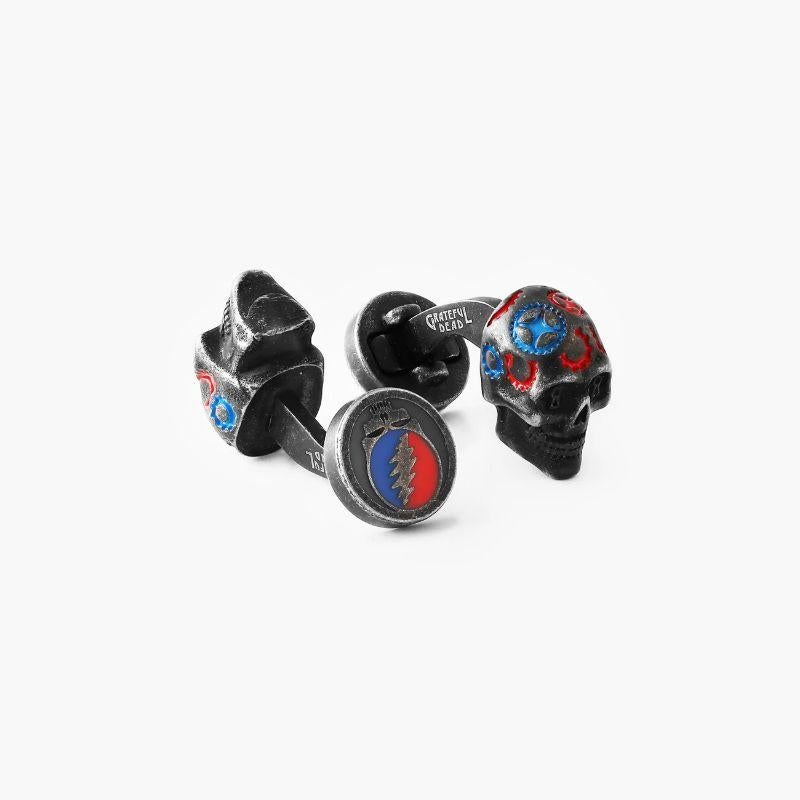 Gear Skull cufflinks in black IP plated stainless steel

The painted skull is a Tateossian take on the Grateful Deadâ€™s Iconic skull, featuring classic Tateossian gears with a psychedelic twist. The cufflinks feature artwork from their album
