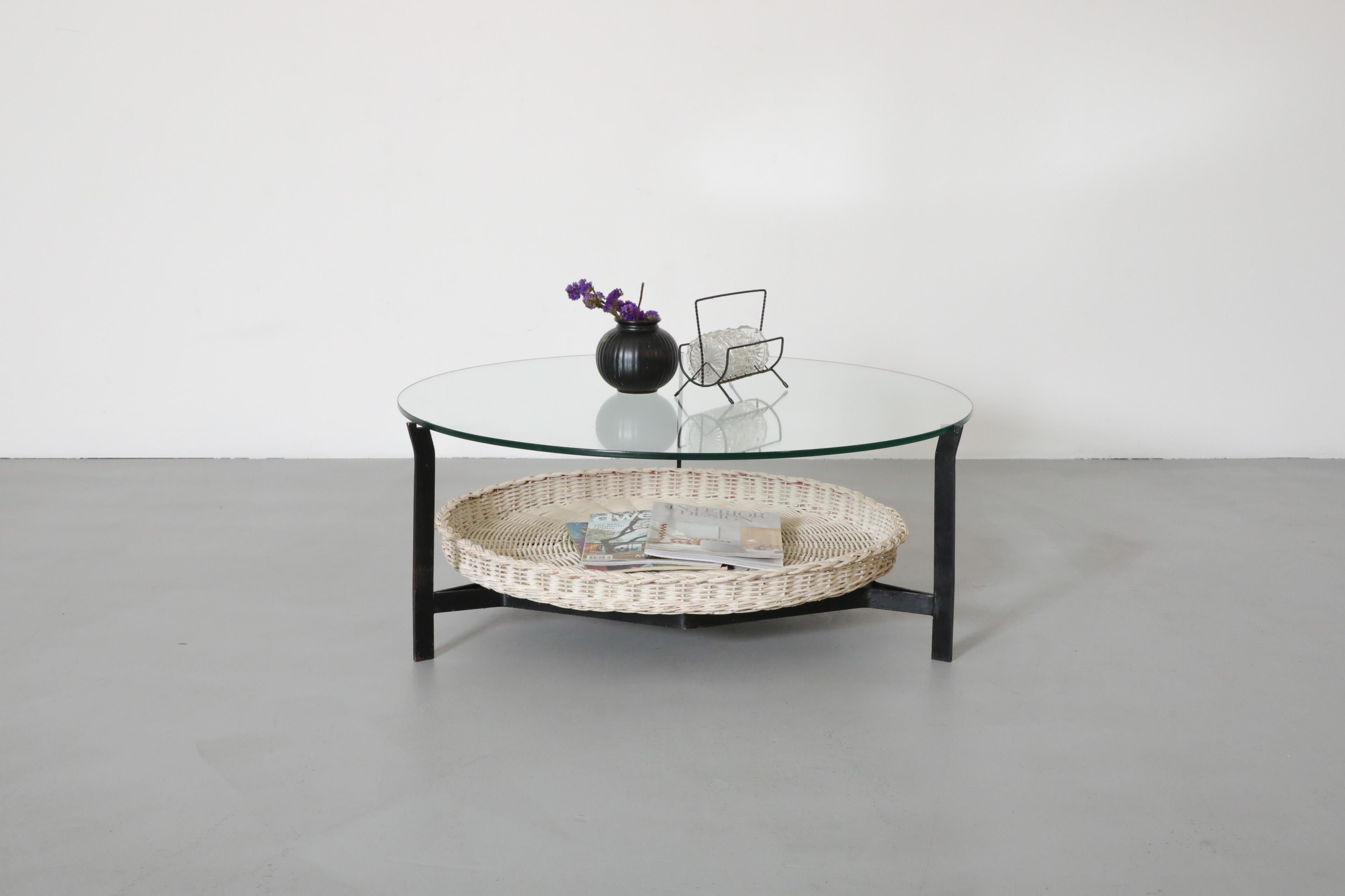 Dutch Mid-Century, Modernist coffee table with handsome, black enameled metal frame, hand-woven white rattan basket and a glass top. Design is attributed to prolific post-war designer Dirk van Sliedregt for the Gebr. Jonkers company. The table