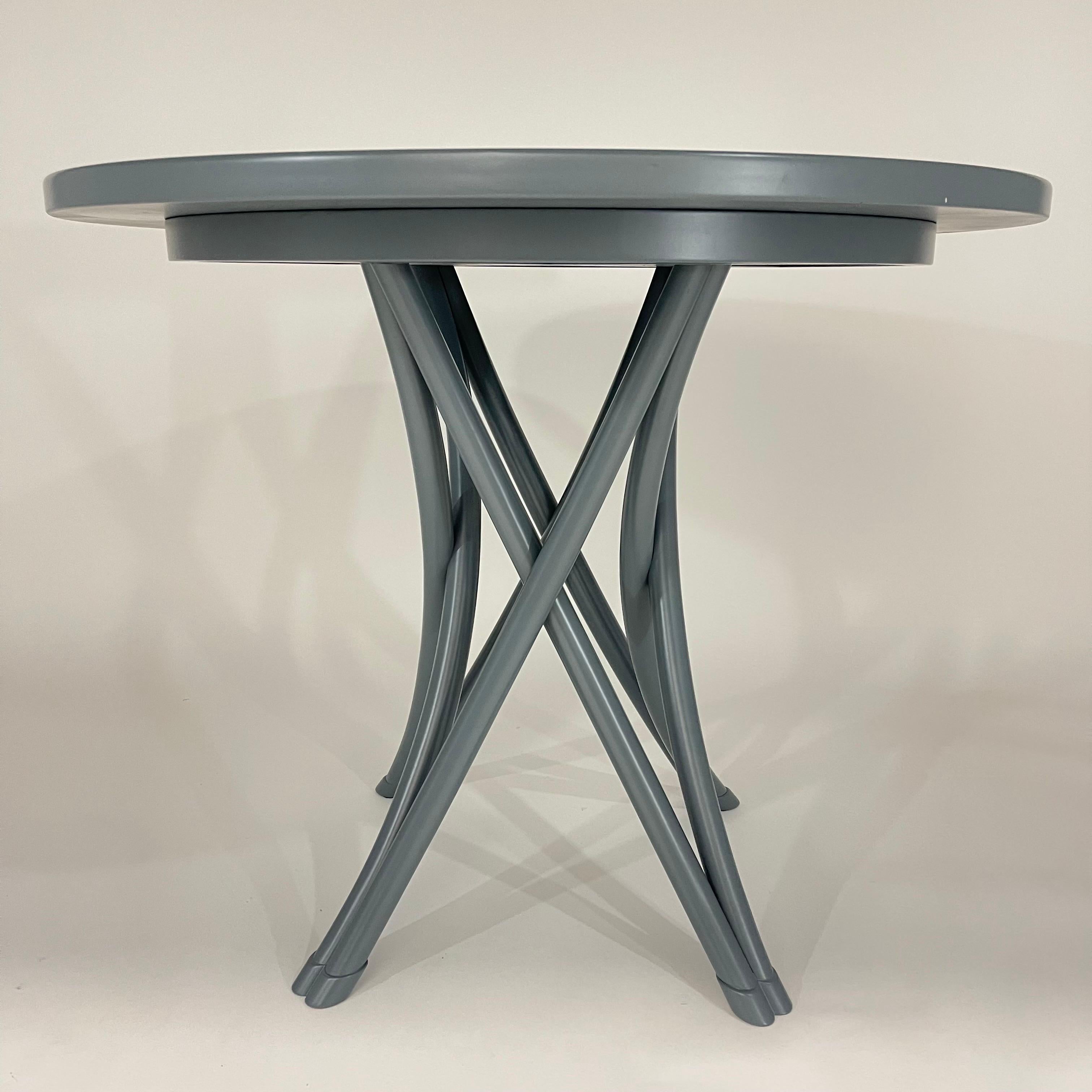 Iconic Rehbeintisch bistro dining table by Gebrüder Thonetm rendered in Beech wood with a bentwood frame. Versatile size is perfect for 2 or 4 chairs, dining, games, center, entry, side or end table.  Color is D12 RAL 7031 Blue Grey.