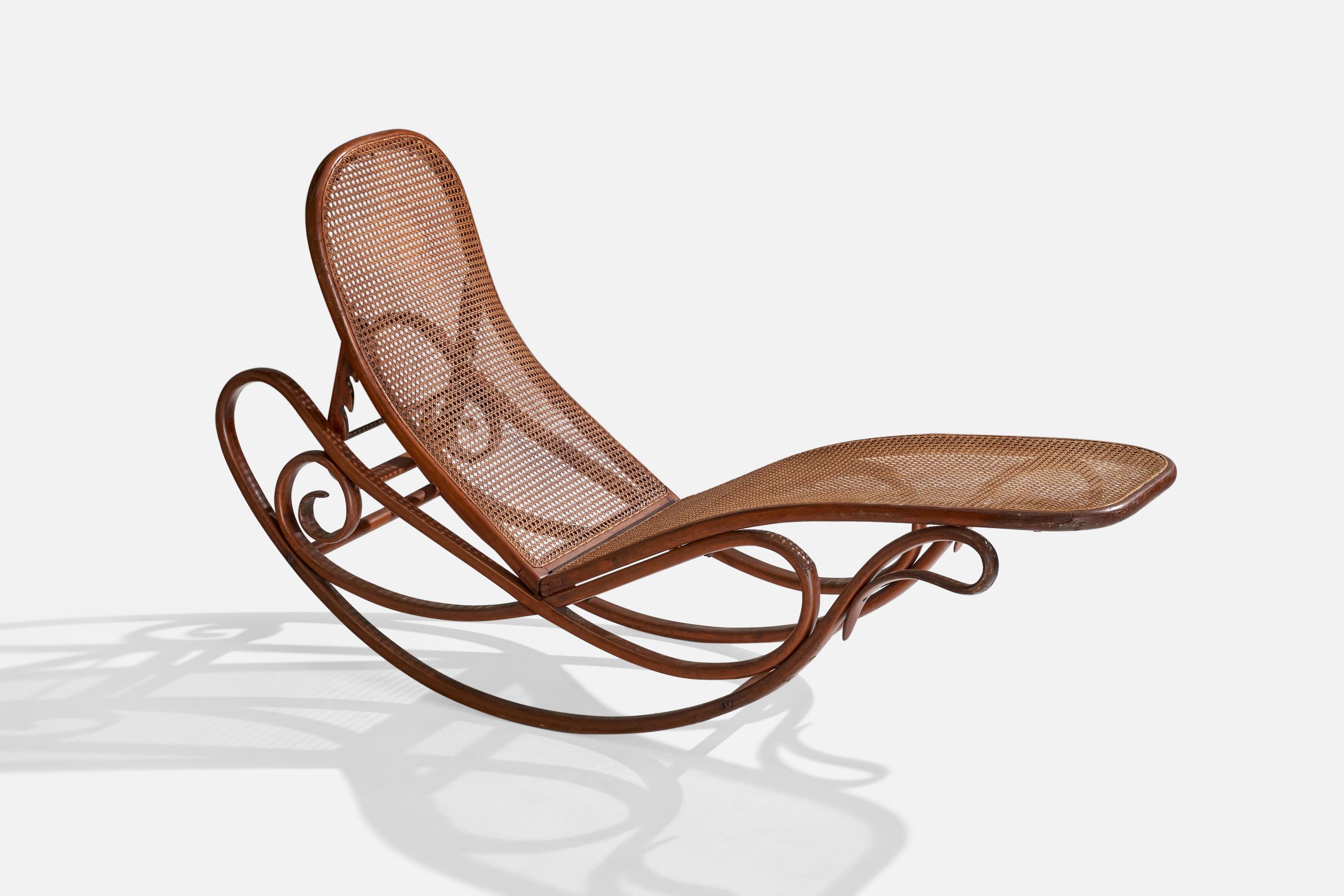 An adjustable bentwood and cane rocking chaise longue designed in 1880-1883 and produced by Gebruder Thonet, Vienna Austria, c. 1900.


