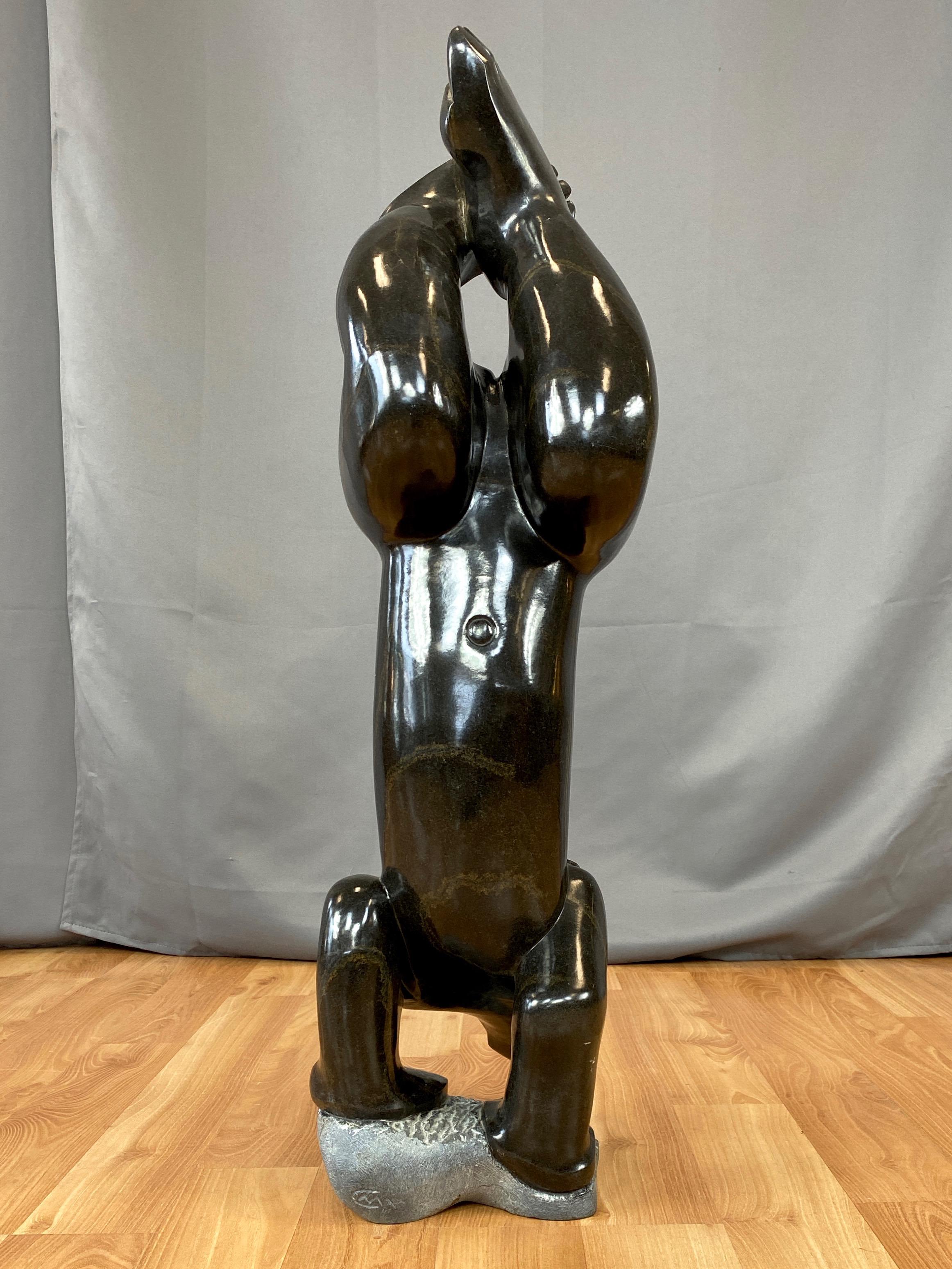 Gedion Nyanhongo “Exercising”, Large Shona Springstone Sculpture, 1990s In Good Condition For Sale In San Francisco, CA