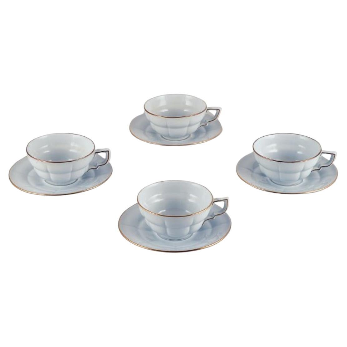 Gefle, Sweden. Set of four "Grand" Art Deco teacups with matching saucers. 
