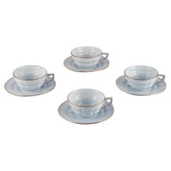 Gefle, Sweden. Set of four "Grand" Art Deco teacups with saucers. 1940s