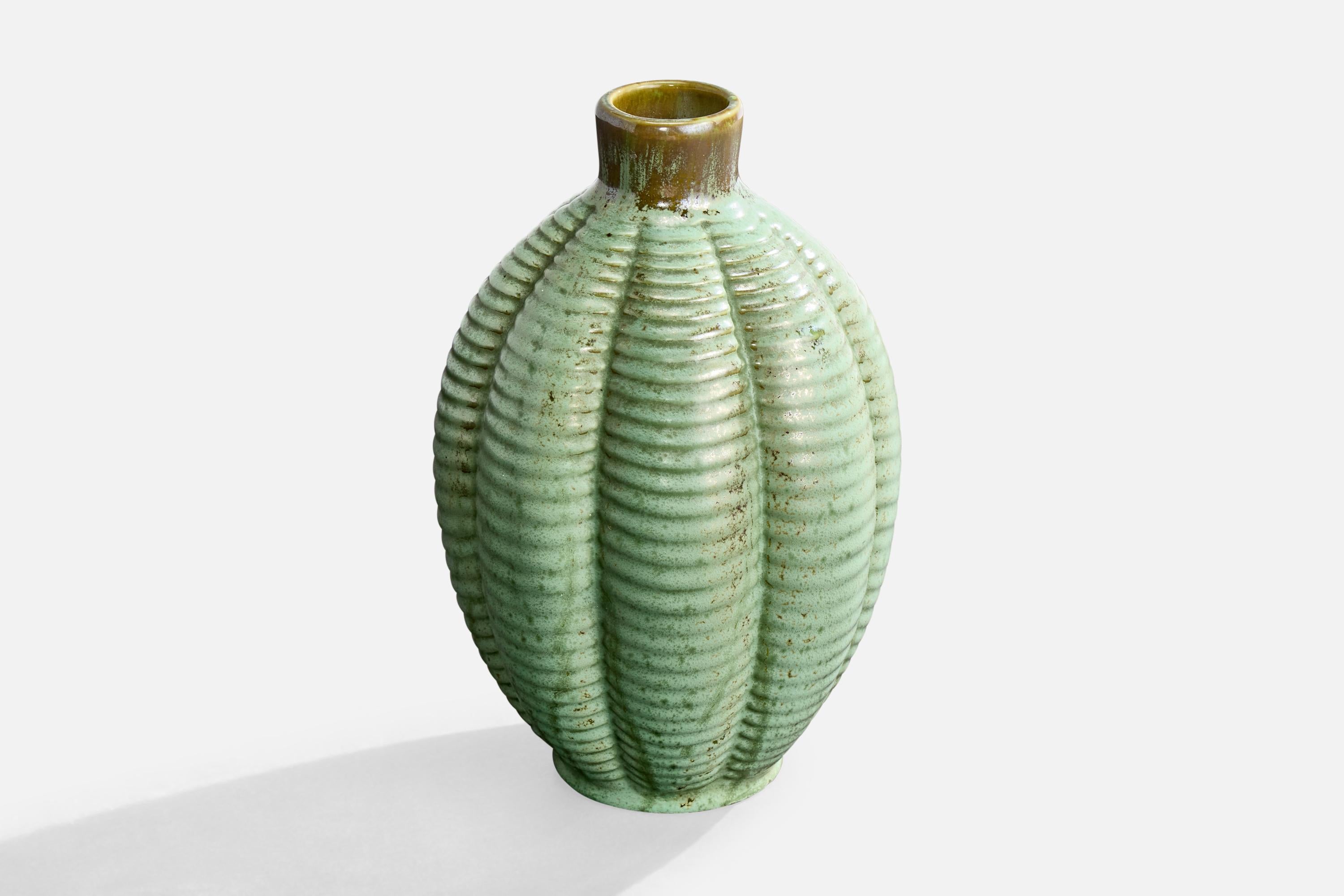 A green-glazed incised ceramic vase produced by Gefle, Sweden, c. 1930s.

Wear consistent with age and use

Overall Dimensions (inches): 8.75