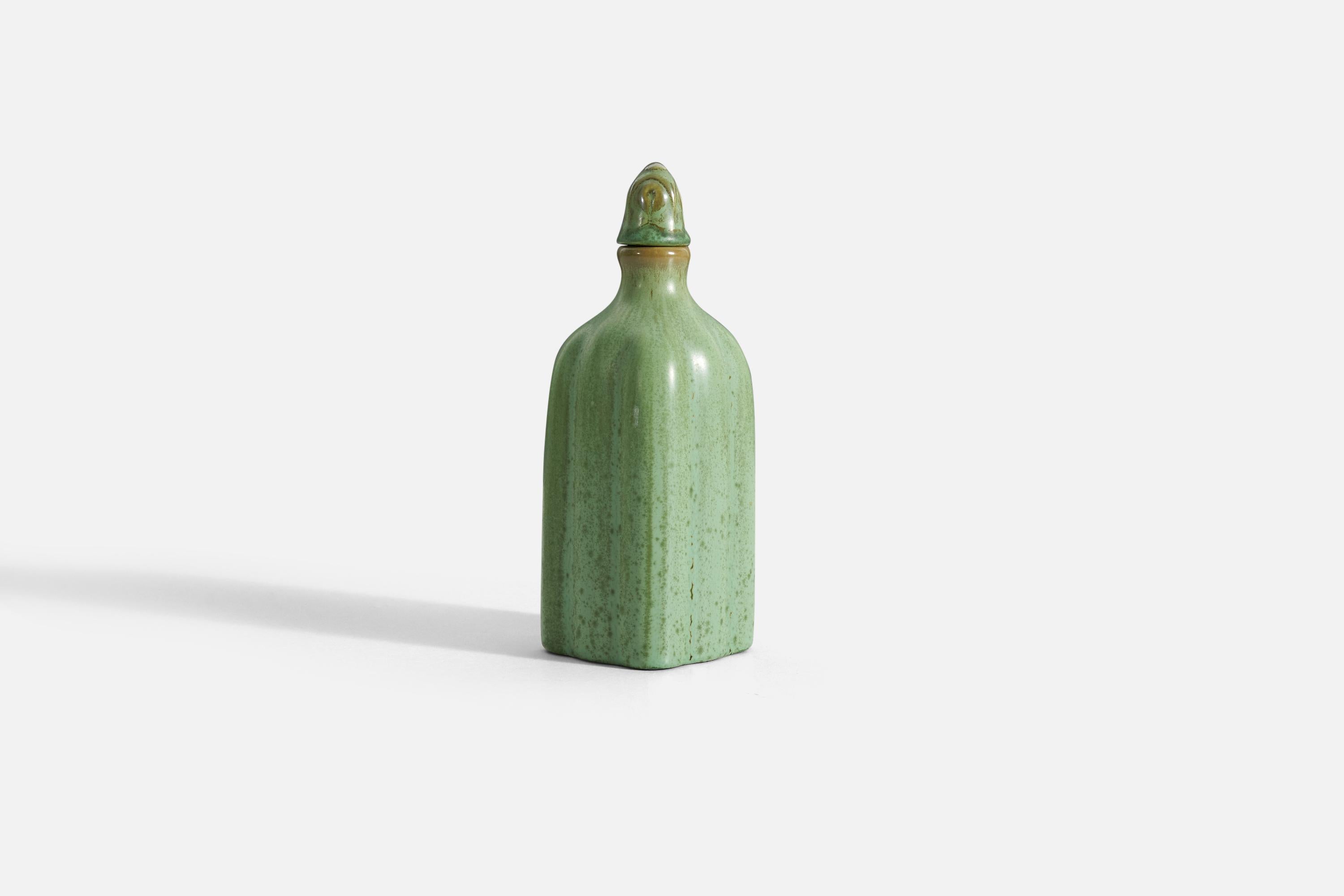 A green-glazed earthenware vase or bottle, with a stopper. Design and production attributed to Gefle, Sweden, 1930s.