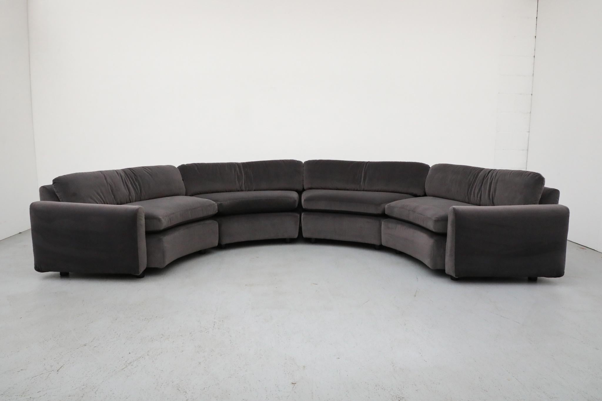 Striking Dutch Mid-Century U-shaped modular sofa manufactured by Gelderland in the 1970s. This sculptural seating arrangement features four individual curved sections—two center units and two end modules with low, sloped armrests—that form a