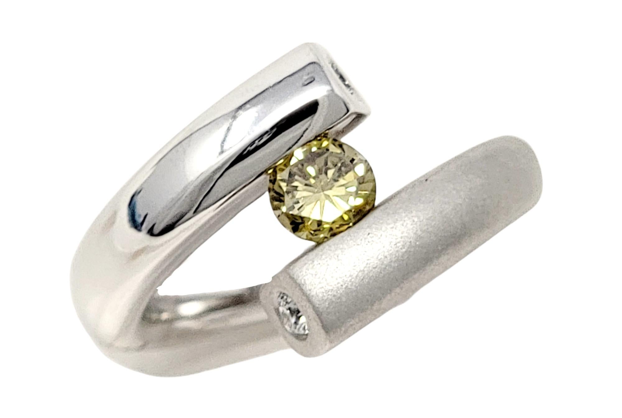 Ring size: 7.25

Stunning, ultra-modern diamond band ring by jewelry designer, Gelin Abaci. This contemporary beauty features a single round brilliant diamond, fancy brownish-yellow in color. This hue of this gorgeous stone is known as a 