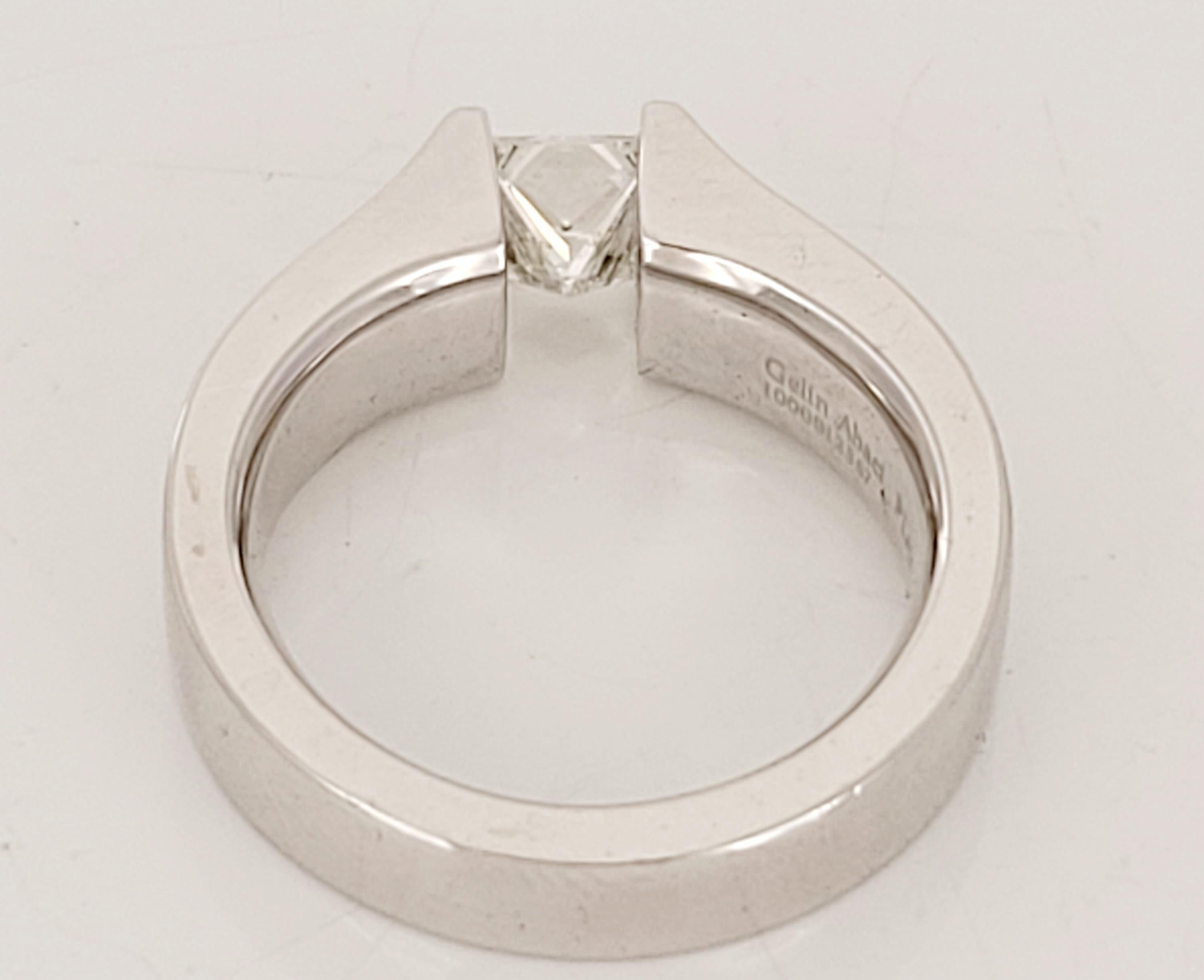 Gelin Abaci Princess Cut Tension Set Diamond Ring.
Diamond 0.90 carat
Princess Cut, G color and VS clarity. 
Set in Platinum 17.1 grams.
Size 6.75. 
Retail Price $6900.