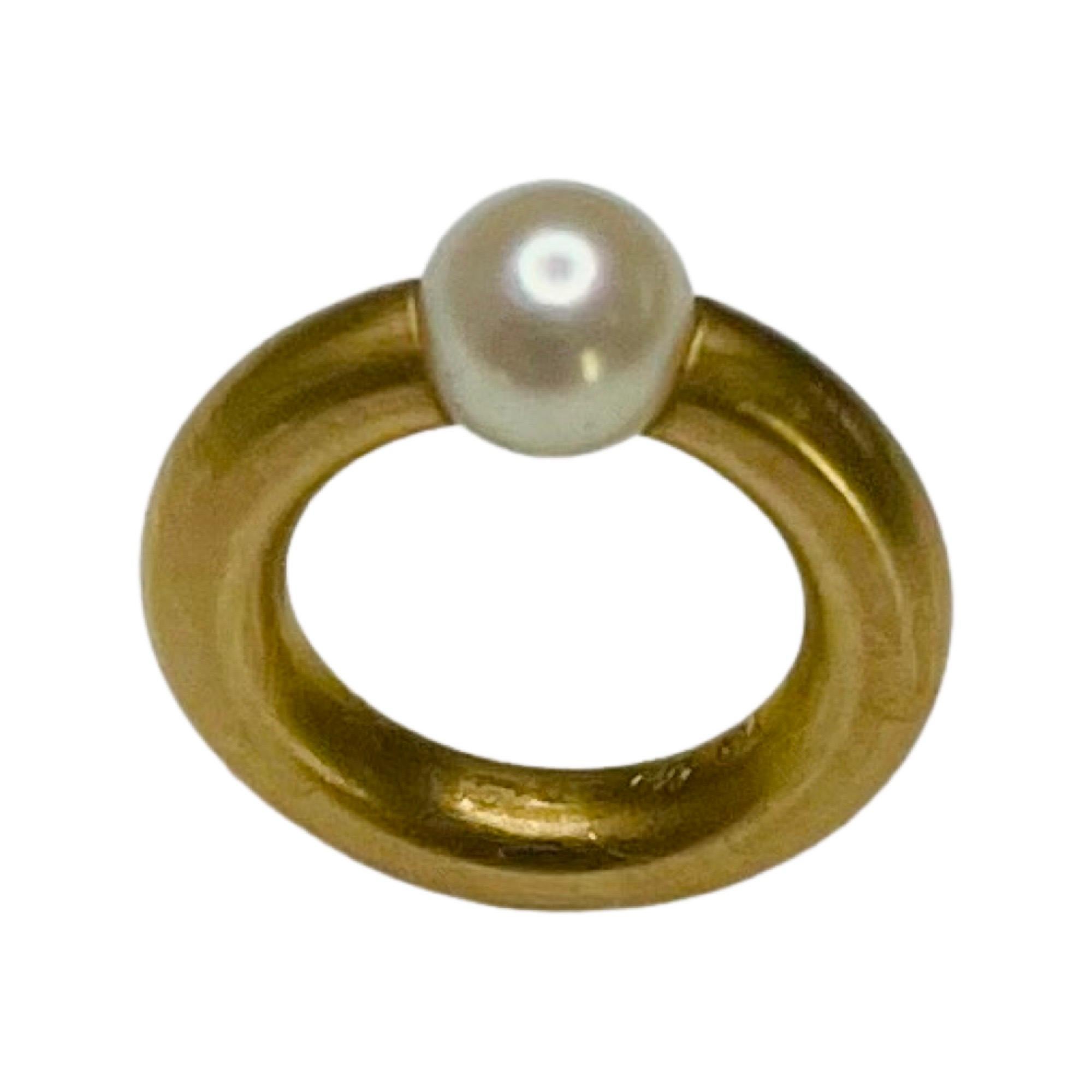 Gellner 18K Yellow Gold Baby Akoya Pearl Ring. This a ring for a baby usually worn on as a necklace.  It is a symbolic and traditional baby gift.  This is more of a charm than a ring. The inside diameter is 9.3 mm and the outside diameter is 13.3