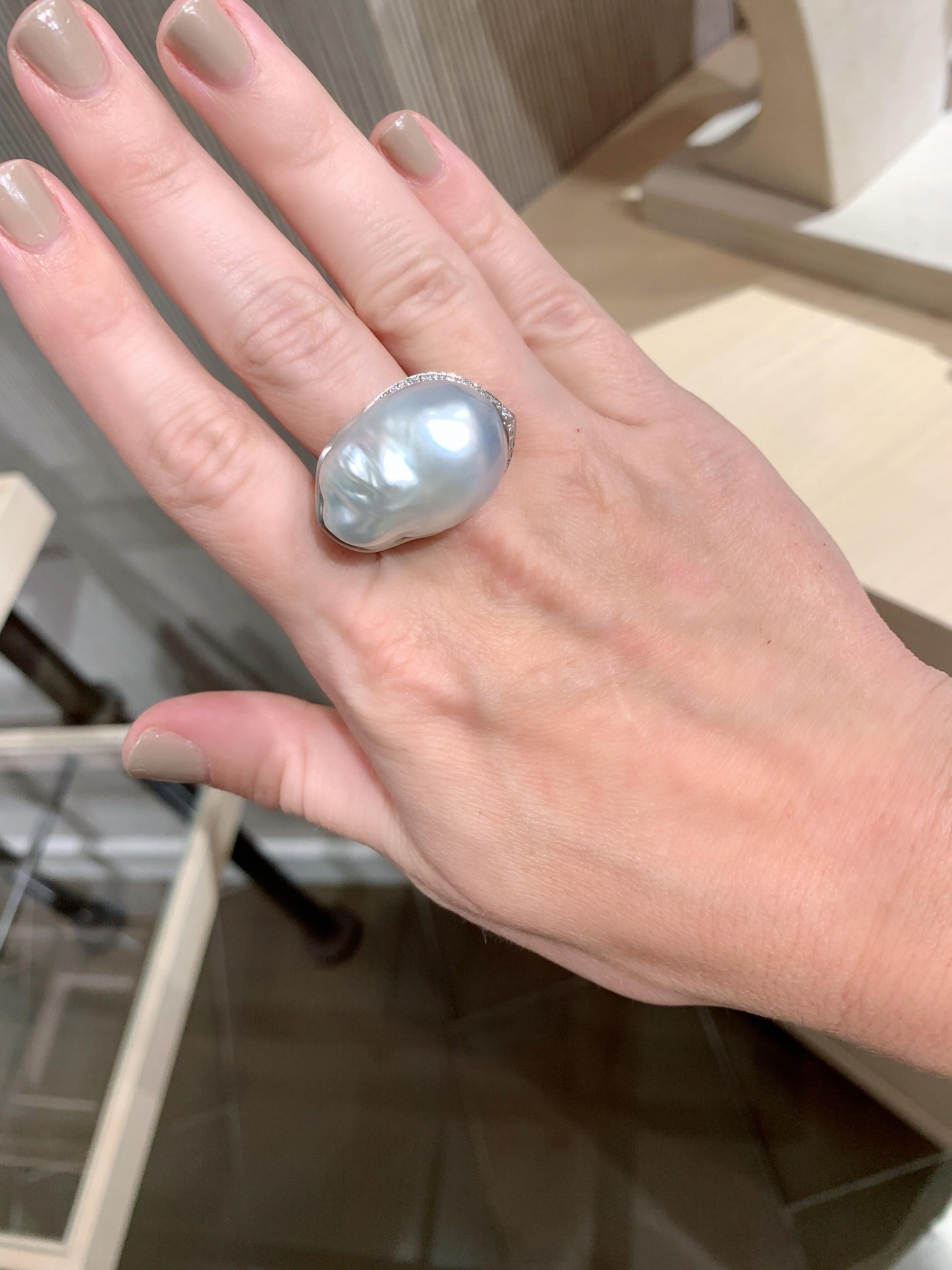 The definition of a statement ring, this one of a kind masterwork is hand-fabricated in brushed platinum by Gellner, showcasing an absolutely extraordinary, tremendous 27mm x 19mm silver South Sea baroque pearl with beautiful luster, gracefully