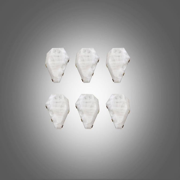 Group of six fine carved diamond form rock crystal sconces with antique brass mounts. Created by Phoenix Gallery, NYC.
Each sconce installed two sockets, use candelabra lightbulbs, 120W total
Custom size and metal finish upon request.