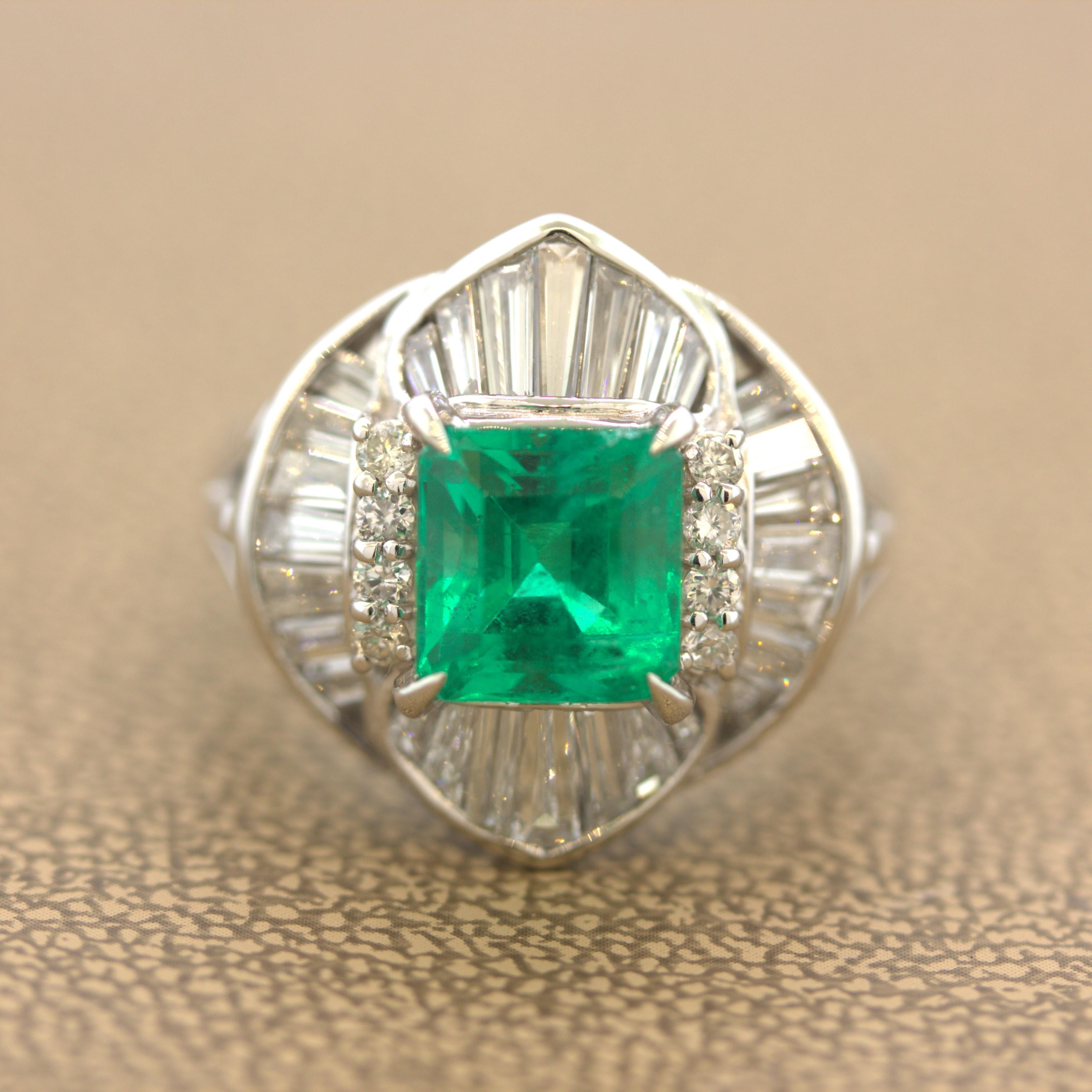 A very fine emerald, most likely from Colombia, takes center stage of this classy platinum diamond ring. It weighs 2.25 carats and has the ideal gemmy green color which made emerald the most famous and popular green gemstone. It has a balanced