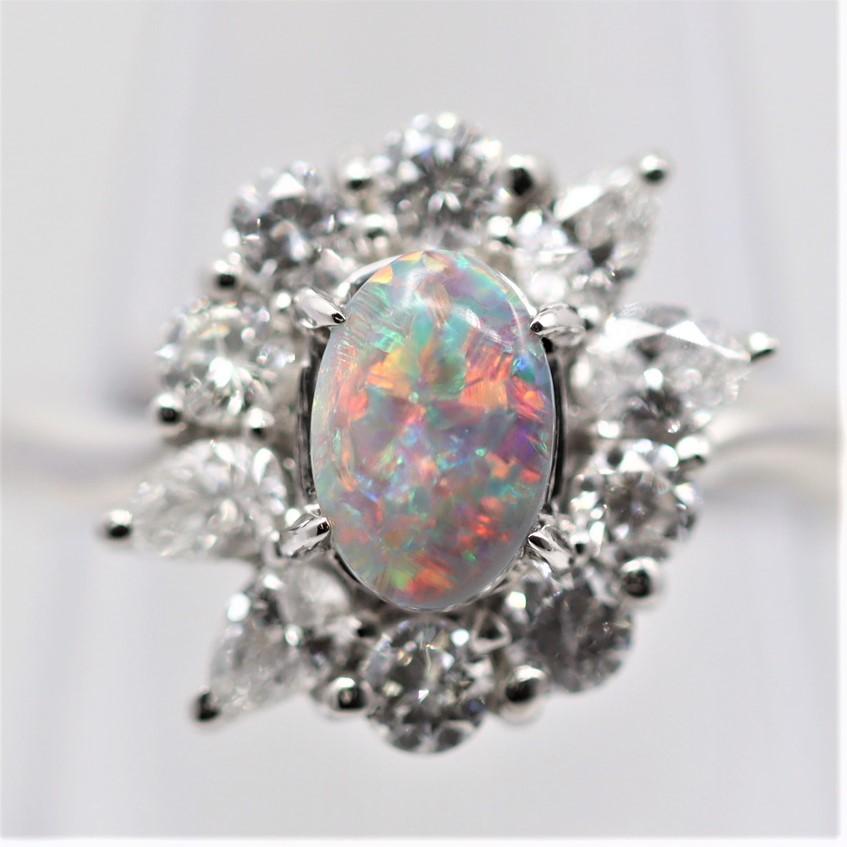 What it lacks in size, weighing 0.70 carats, it makes up in its amazing gem quality. The play-of-color of this Australian black opal is one of the finest. Bright gemmy flashes of reds, blues, and greens dance across the stone as light hits it. It is