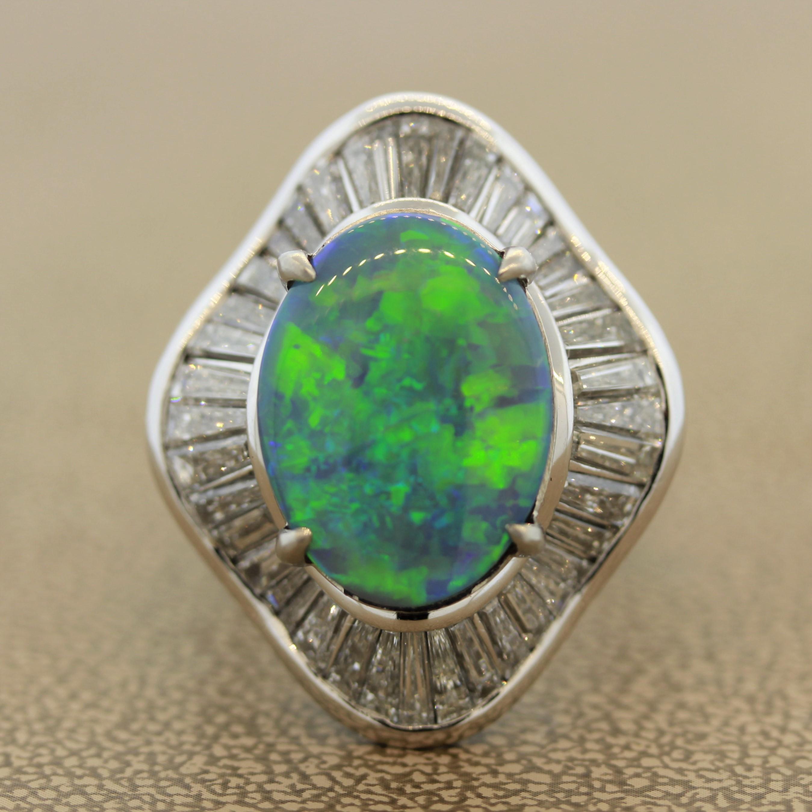 A superb gem quality example of a fine Australian opal. Most likely from a mine in Lightning Ridge, this opal has excellent play of color with bright flashes of predominantly green and blue. It weighs 7.39 carats and was beautifully cut as a classic