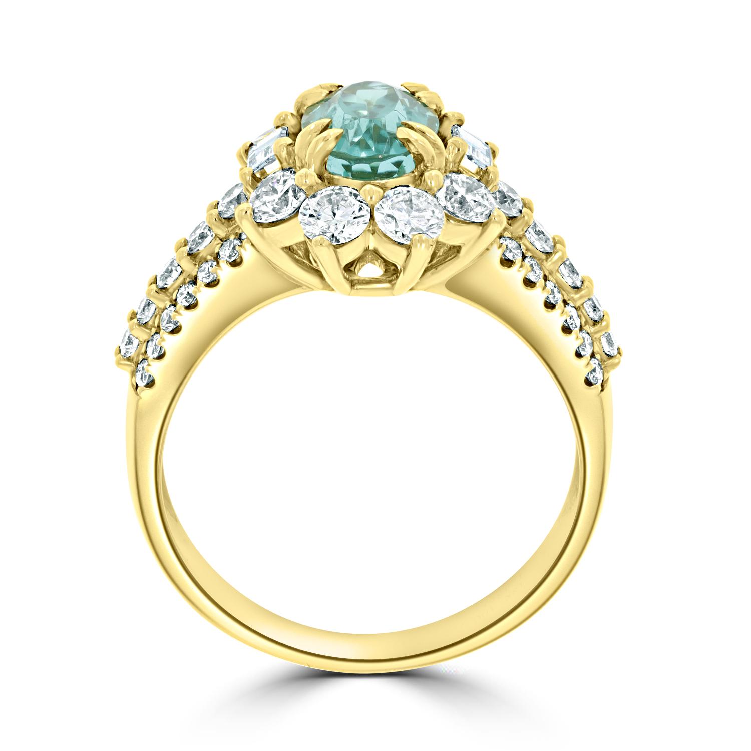 Crafted Of 18k Yellow Gold, The Richness Of This Elegant Ring Is Showcased By Its Endless Glow. Decorated With A Striking Oval Cut Paraiba Which Is Bordered By Charming Round Cut Diamonds, This Exquisite Jewelry Spreads A Glorious Shine That Is Hard