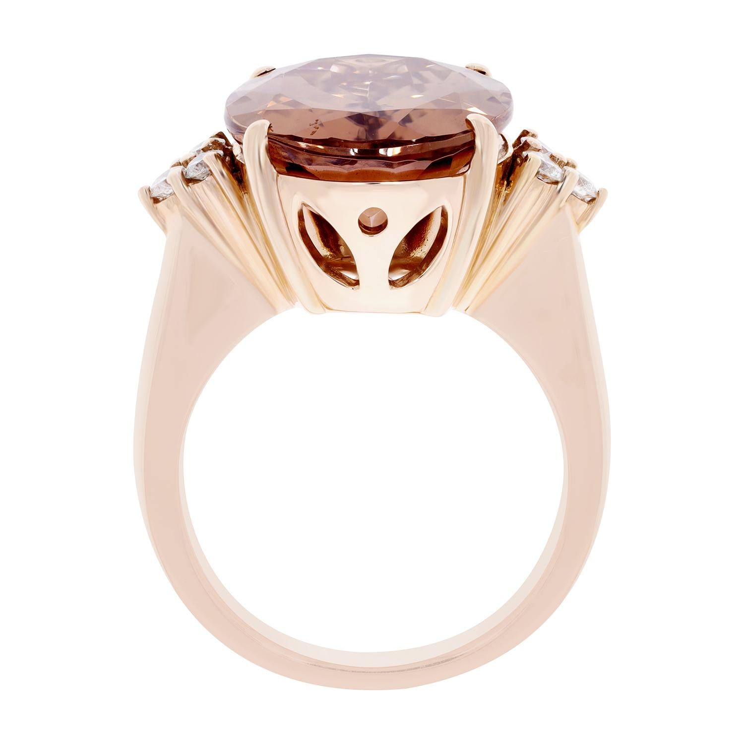 This luxury style ring is an instant style boost that gels well with every style outfit. The admirable part is its eye-catching design that showcases oval-cut pink Zircon and round Diamonds in 14kt rose gold.