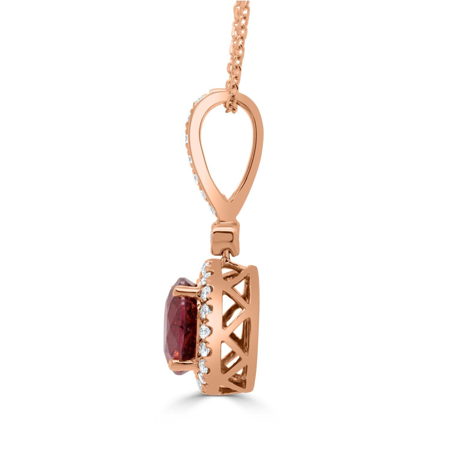 Somewhere between Pink Tourmaline and Rubellite, this gorgeous piece has an amazing bright red-pink blush color. Set in a classic halo design by our artisan jewelers, this pendant also features 0.22ct of diamonds in 14K Rose Gold. Wear this pendant