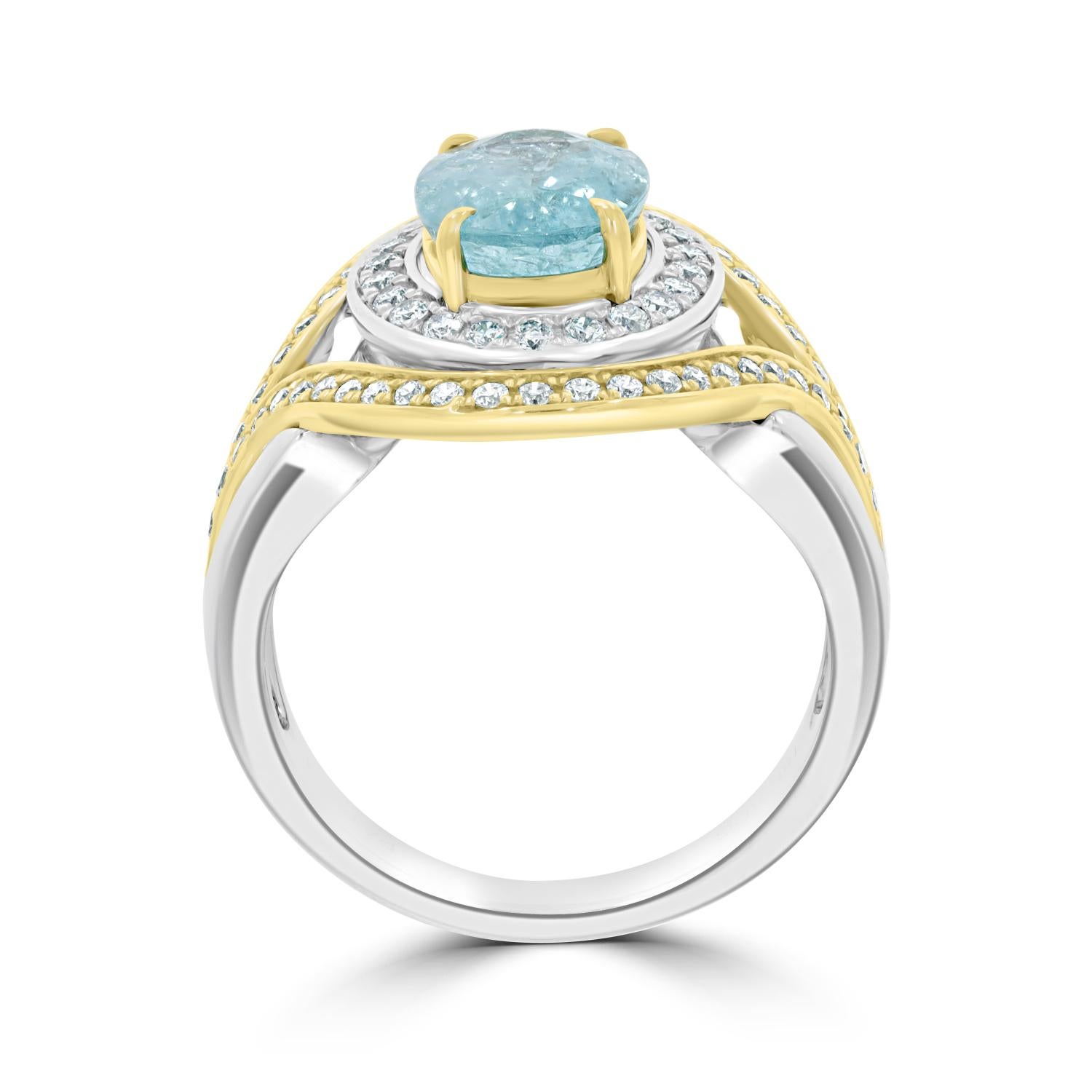 A bright oval cut Paraiba, offset by gorgeous round diamonds makes this fascinating ring a worthy investment. Crafted in 18K two tone gold, its radiance can be seen from a distance, attracting attention. A fantastic fusion of latest trends and