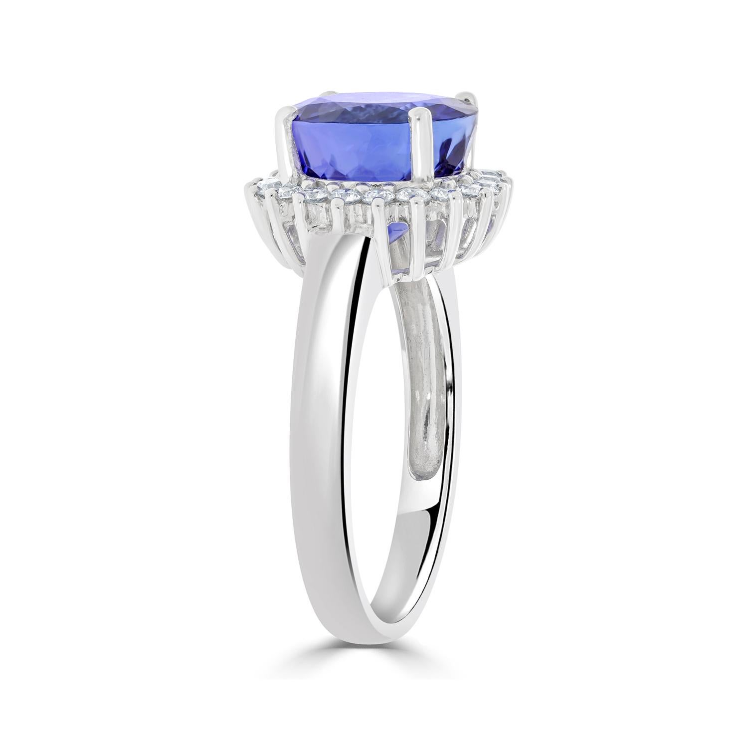 Don't Miss Out On This Artful Ring That'll Look Good With Every Style Outfit And Suit Every Occasion. The Top-notch Work With 18kt White Gold Offers A Trendy Look. Set With Tanzanite And Round Diamonds, The Ring Will Brighten Up Your Style Like