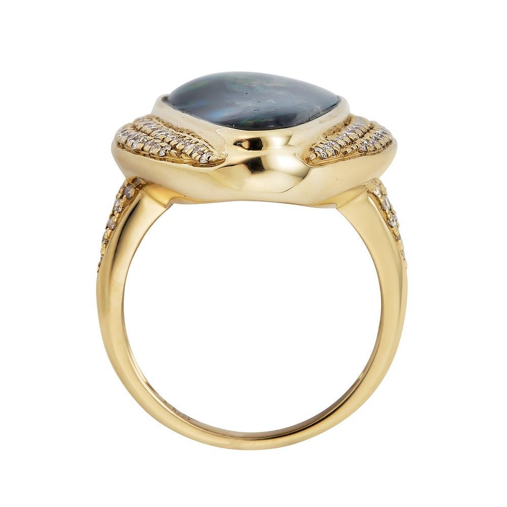 This eye-catching 14k yellow gold ring accentuates luxury and adds a touch of shine to your overall look. A glittering piece of jewelry, sleek in design, this ring features pear shape Opal and round diamonds. Developed to perfection and