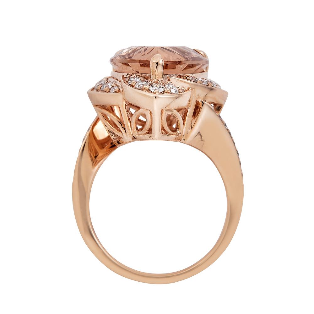 The peach-pink shade of this appealing Morganite shines with radiance in a pear design, highlighting its subtle yet luminous color. Surrounded by glorious round diamonds that give it a striking finish, this excellent ring is sure to make your