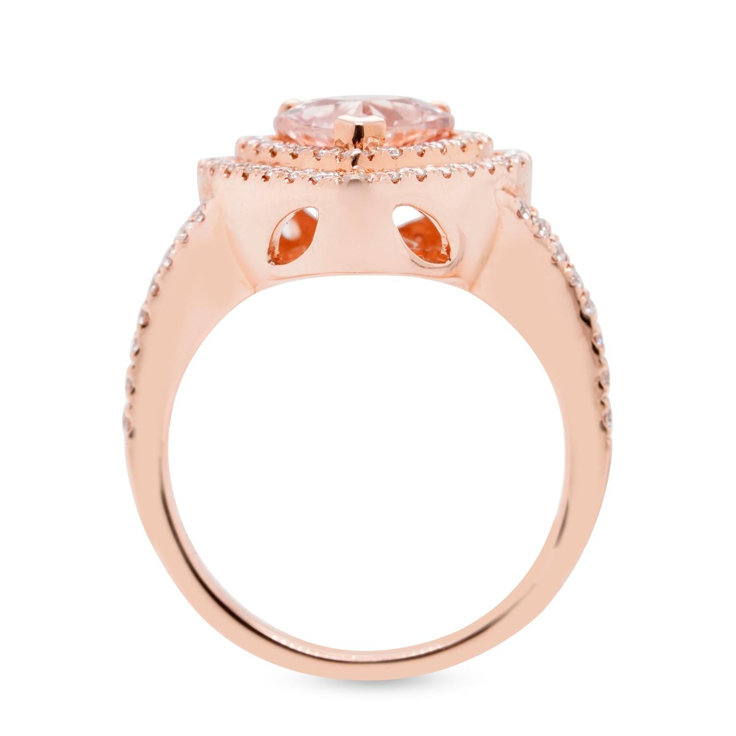 Women love the peachy-pink color of this pretty ring that is accentuated further by the hue this gorgeous Morganite radiates. Crafted in an pear cut, the shimmer and shine of this masterpiece comes from the stunning round diamonds that border the