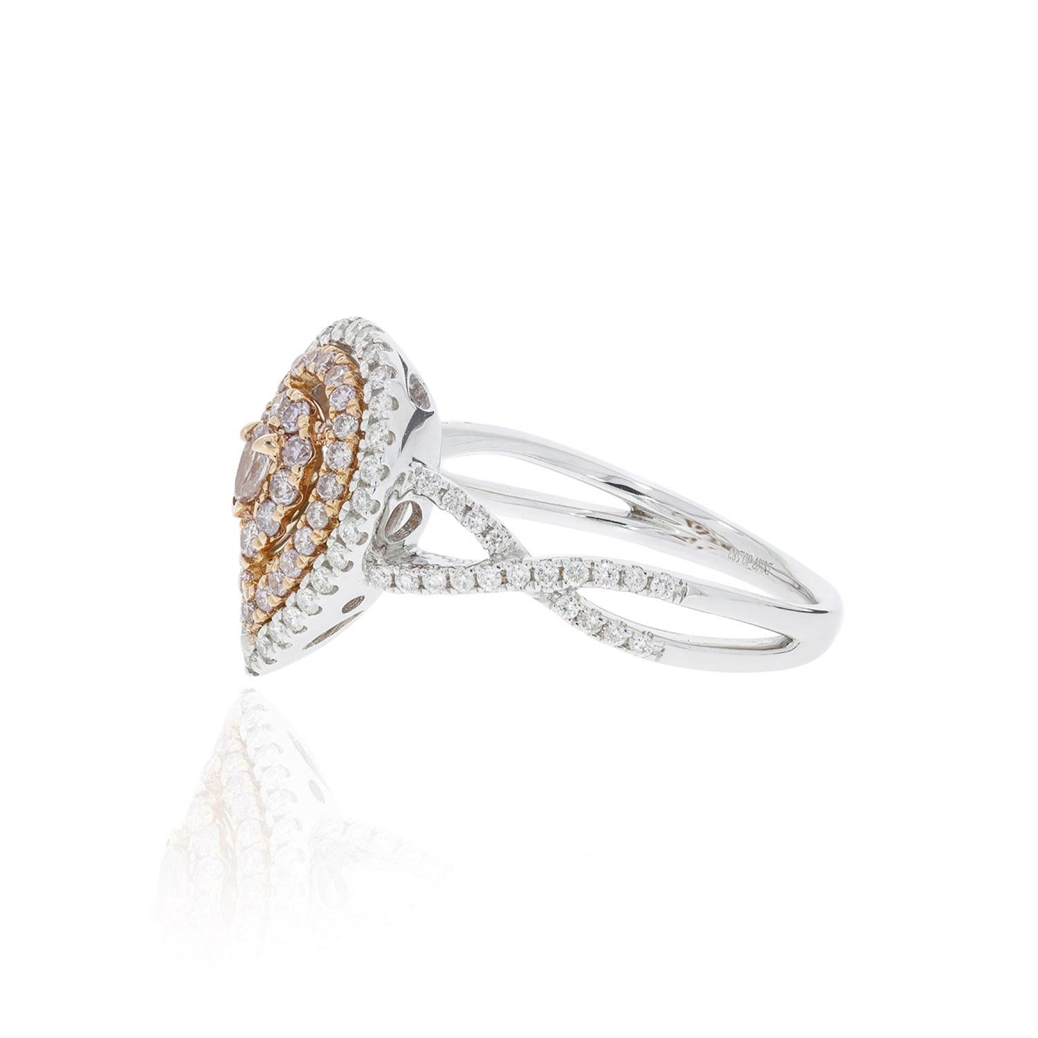Crafted in 18K two tone gold for a rich look, the pear cut Pink Diamond adds glamour that highlights is natural tone. A stunning blend of style and grace, it has round diamonds bordering this mighty jewel which bounces the light off the facets to