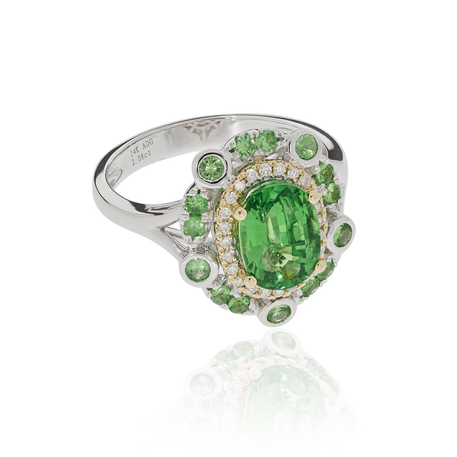 A beautiful combination of classic and modern skills, this magnificent ring adds drama to your look with its breath-taking finish. The Tsavorite spreads its lush green shade with flair in its Diana style design. Crafted in 14K two-tone gold, this