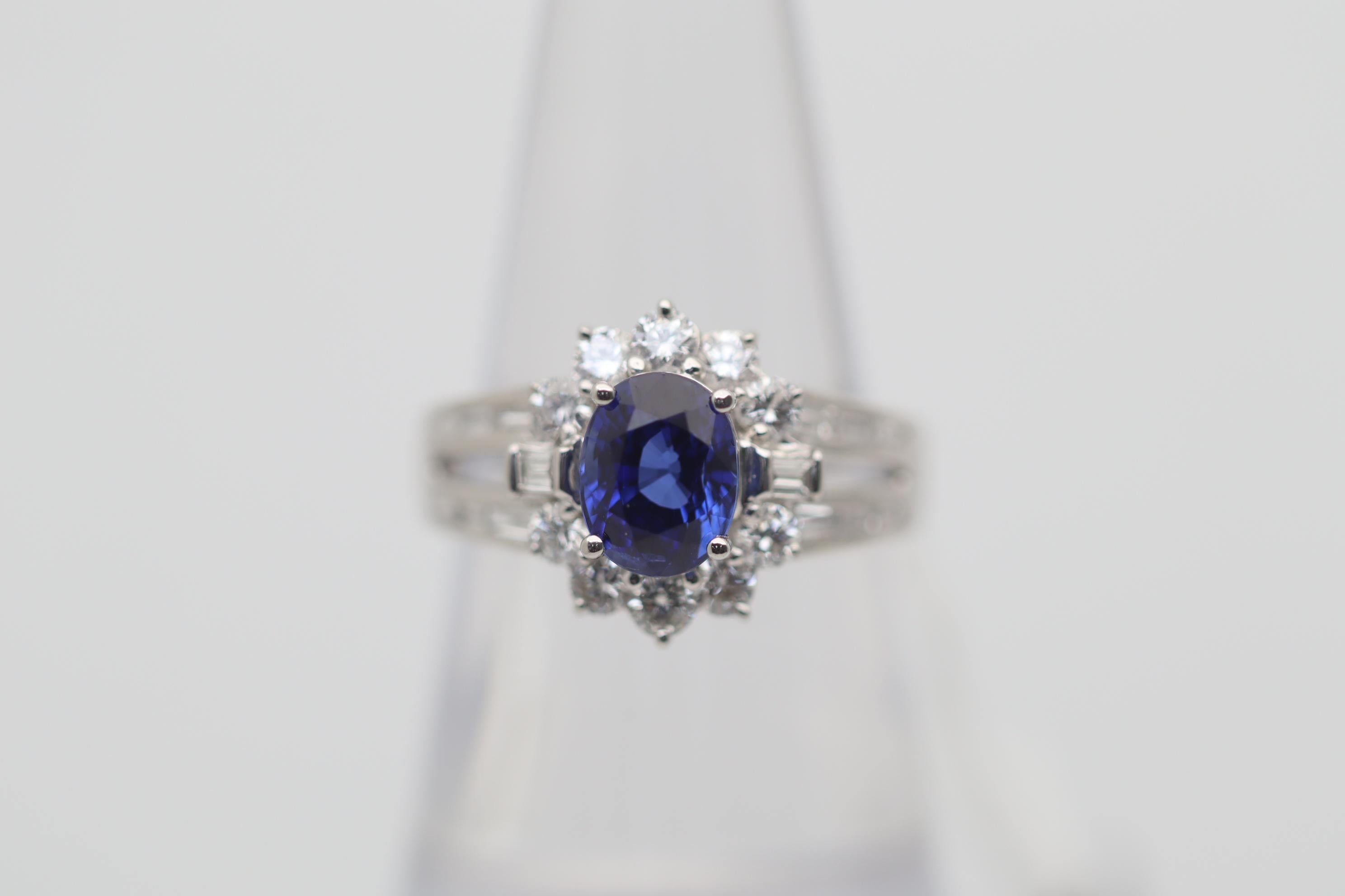 A superb gem blue sapphire of extra fine quality takes center stage of this platinum made ring. The sapphire weighs 2.00 carats and has the perfect blue color, which is rich, bright and shiny, one of the finest we have seen. It is complemented by