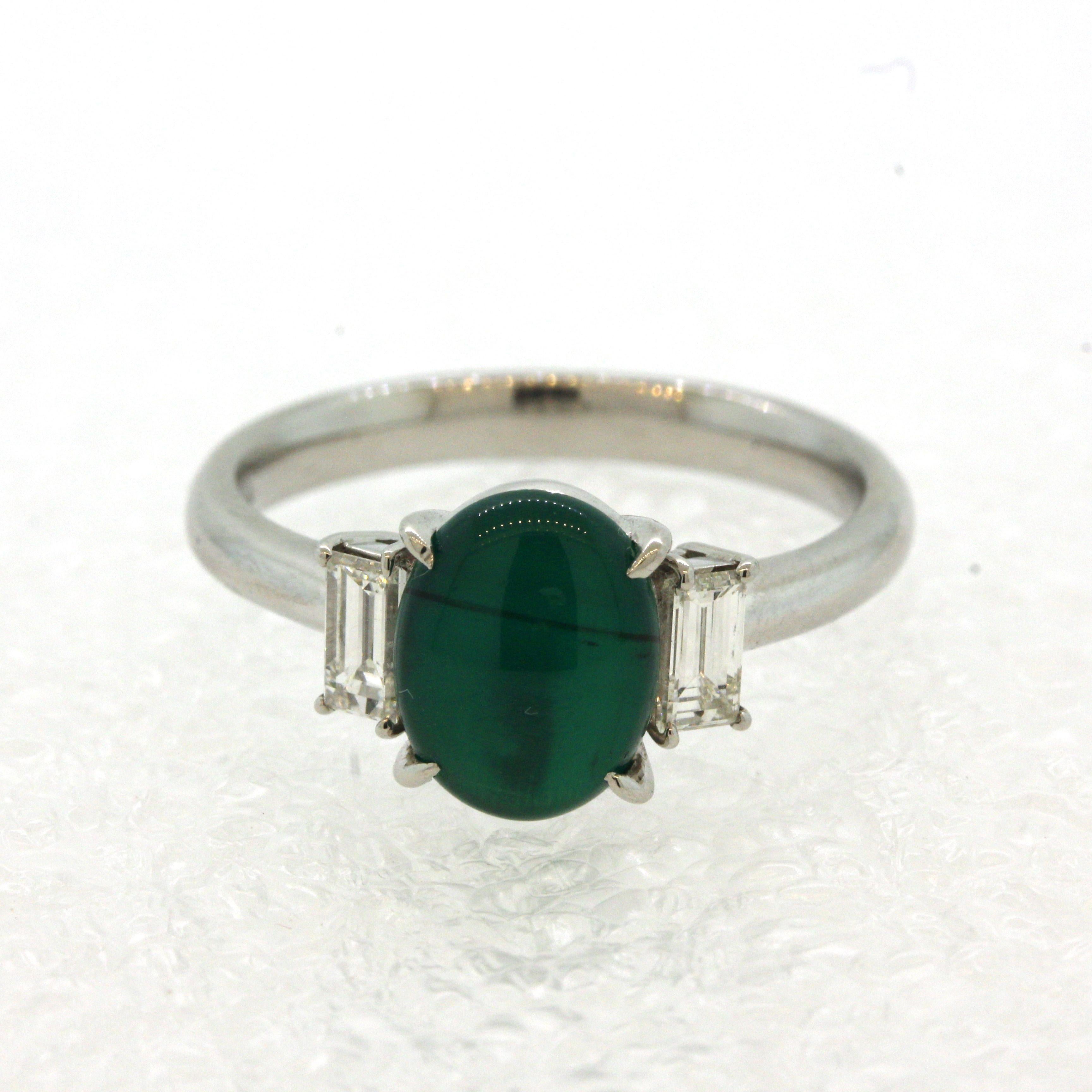 A superb and rare gem emerald with a strong cats eye! The emerald weighs a respectable 1.60 carats and has an incredible vivid green color which is so strong it looks fake! Adding to that, the stone has a strong chatoyant line (cats eye) when a