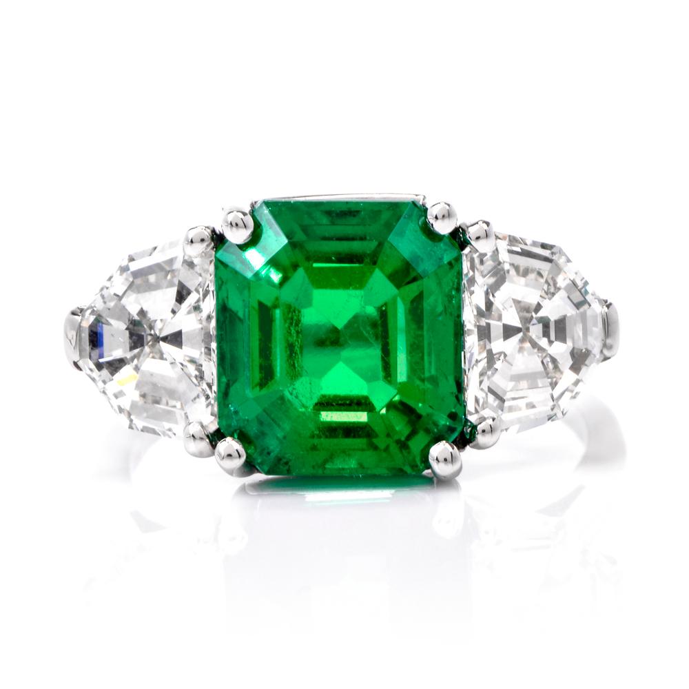 This exquisite handcrafted emerald diamond ring is designed in solid platinum. It exposes at the center an amazing Very high quality Colombian emerald of the finest green color with AGL certificate, weighing 4.47ct measuring 9.93 x 8.90 x 7.07mm.