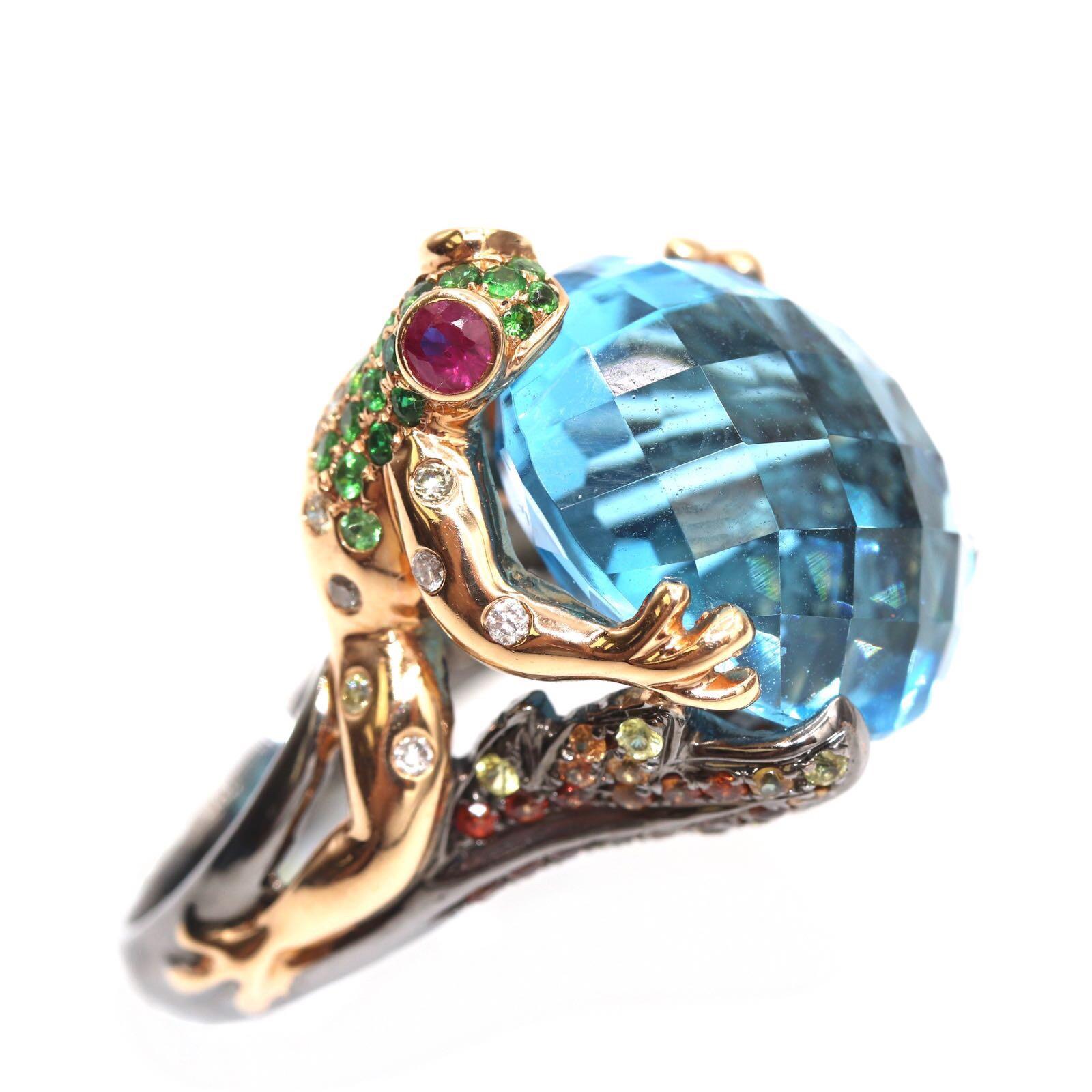 18K Beautiful Frog Ring with Blue Topaz Center Stone , Fancy Dia & Multi Color Sapphires. Ring Size 6.5
21.86 ttw Blue Topaz Center Stone
1.08 ttw Multi Sapphire
0.20 ttw. Diamonds