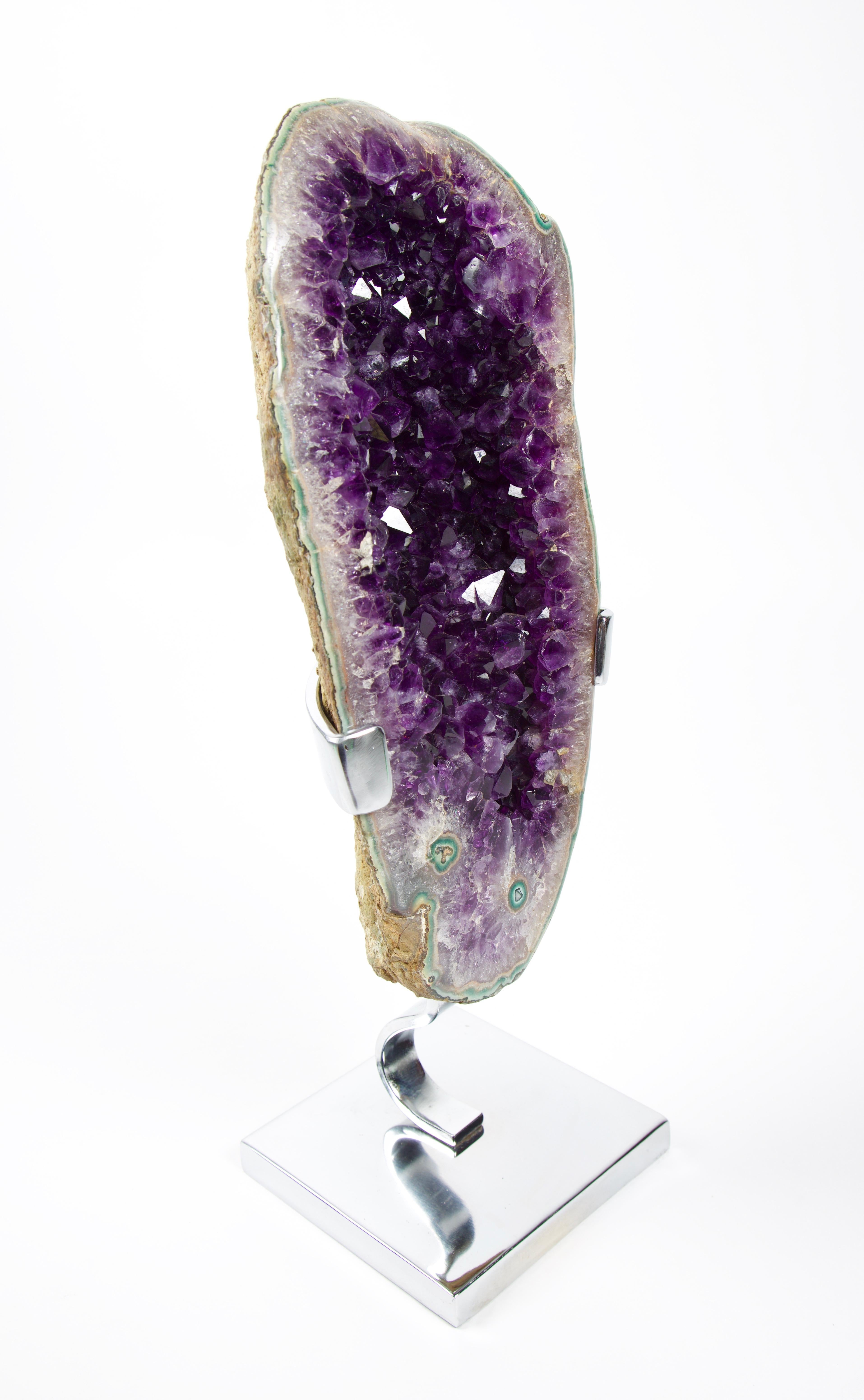 Gem grade Amethyst Geode sculpture
The amethyst geodes from Uruguay are mined from the same rock formation as their relatives just to the north across the border into southern Brazil and are igneous (volcanic) in origin. Uruguay amethyst, however,