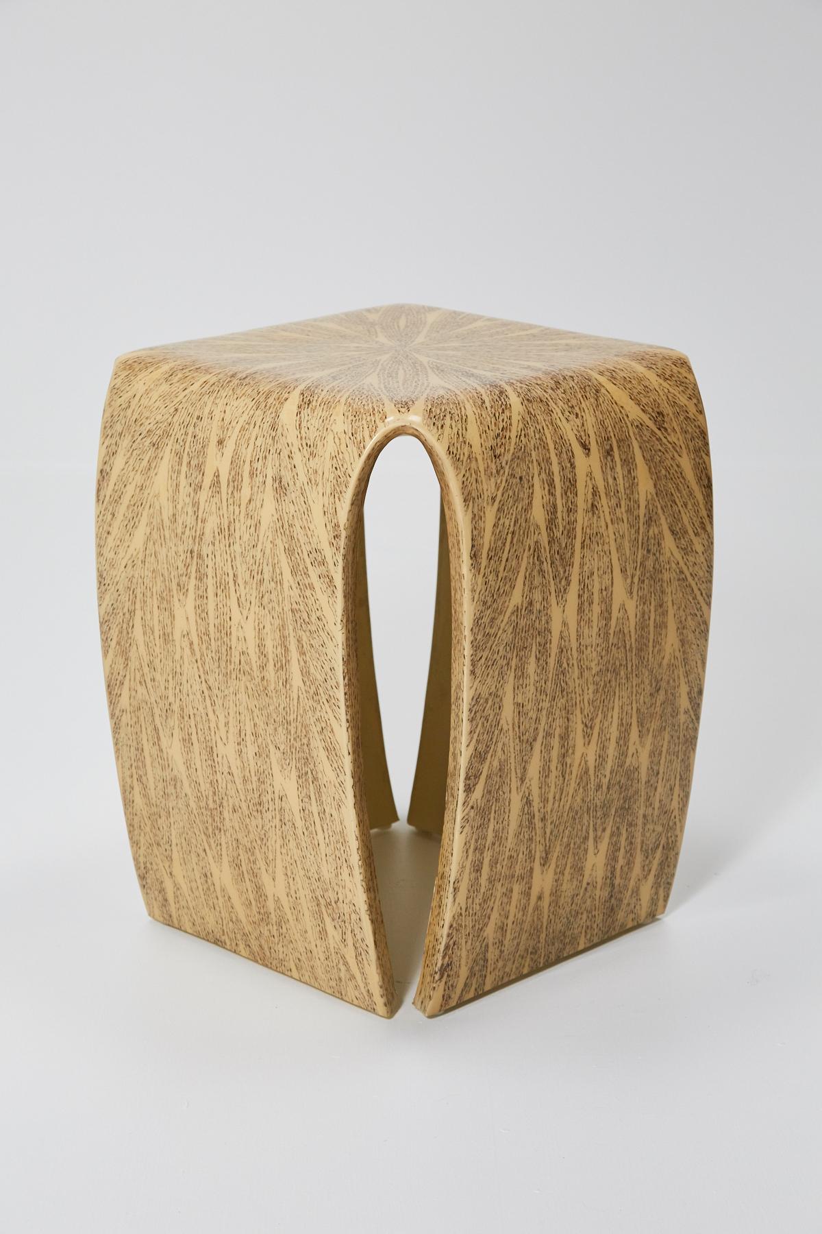 Lacquered side table in a natural tan hue, inlaid with wild pearl vine in the shapes of leaves which form an overall pattern. Fiberglass body with slit corners.

All furnishings are made from 100% natural materials, carefully hand cut and crafted