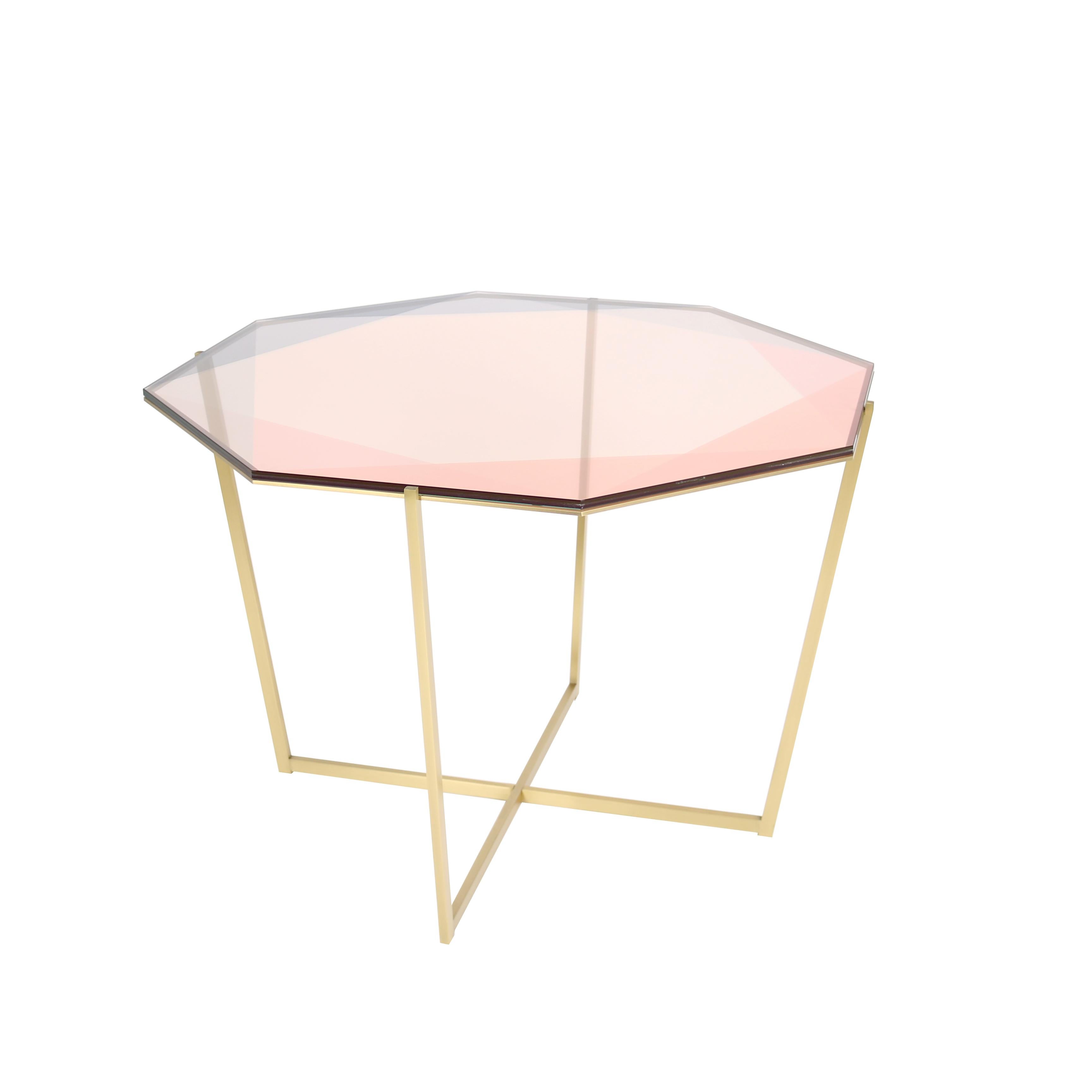 Our Gem collection of tables are inspired by the reflections of light and transparencies found in gemstones. These metal and glass tables translate facets through layers of color and varying opacity. Each table base is designed as a setting with