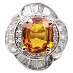 Bague en platine avec saphir orange et diamants, pierre précieuse