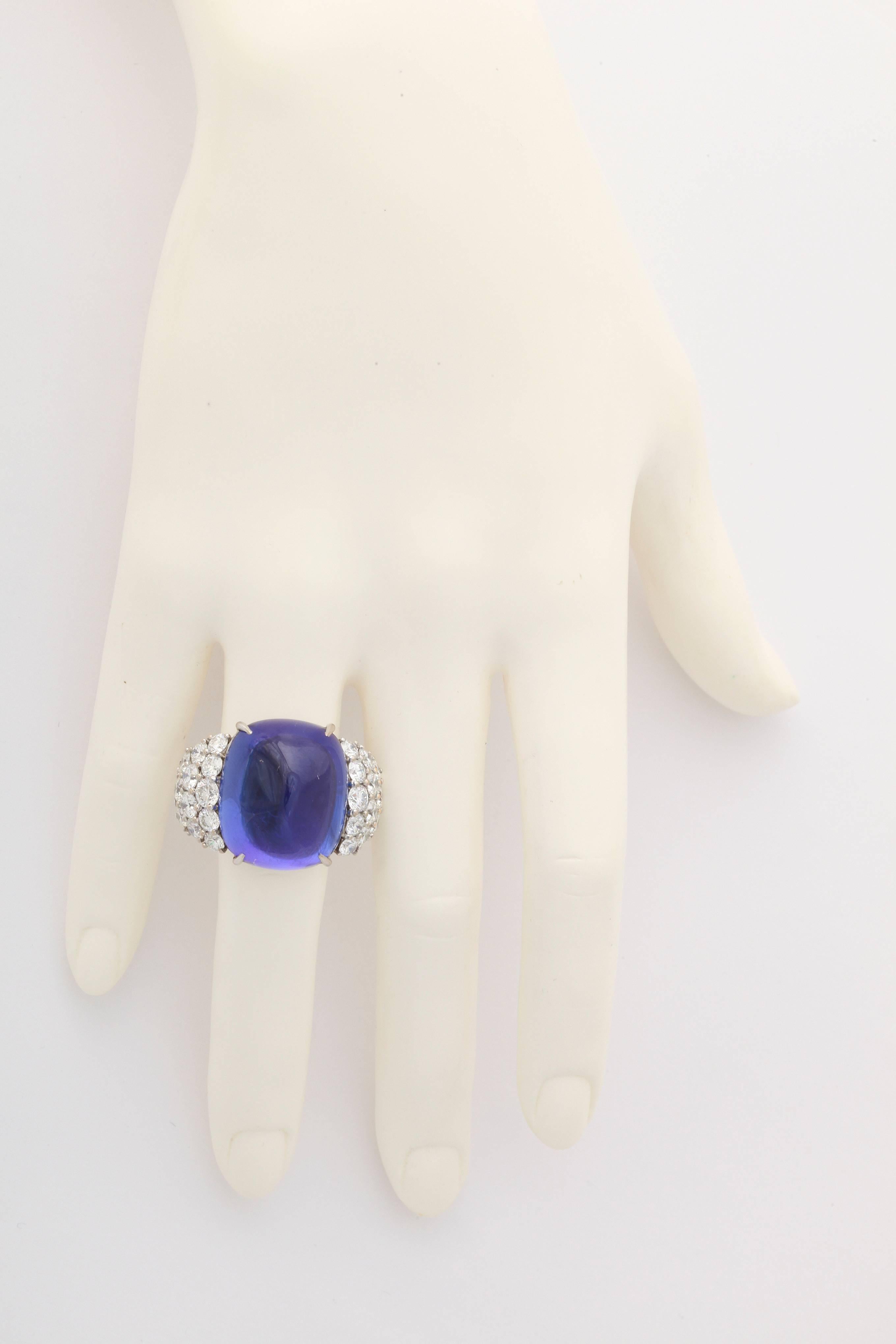 This incredible ring features a sugarloaf cut tanzanite weighing app. 44cts.  The stone is a rich, velvet blue color with undertones of deep purple.  Free of any eye visible inclusions, the size and quality make this stone a truly rare gem.  To