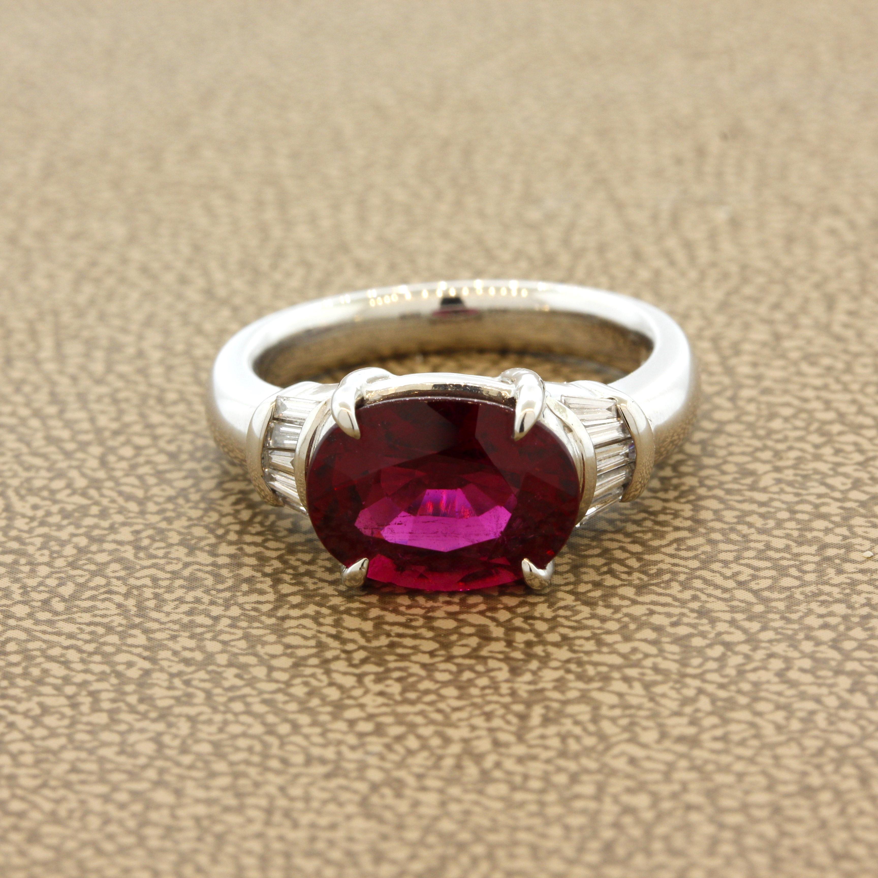 A superb rubelite tourmaline with a vivid red color that will rival any other stone on the market. It weighs 3.58 carats and also has fantastic clarity along with its intense vivid color. It is complemented by 0.15 carats of baguette-cut diamonds