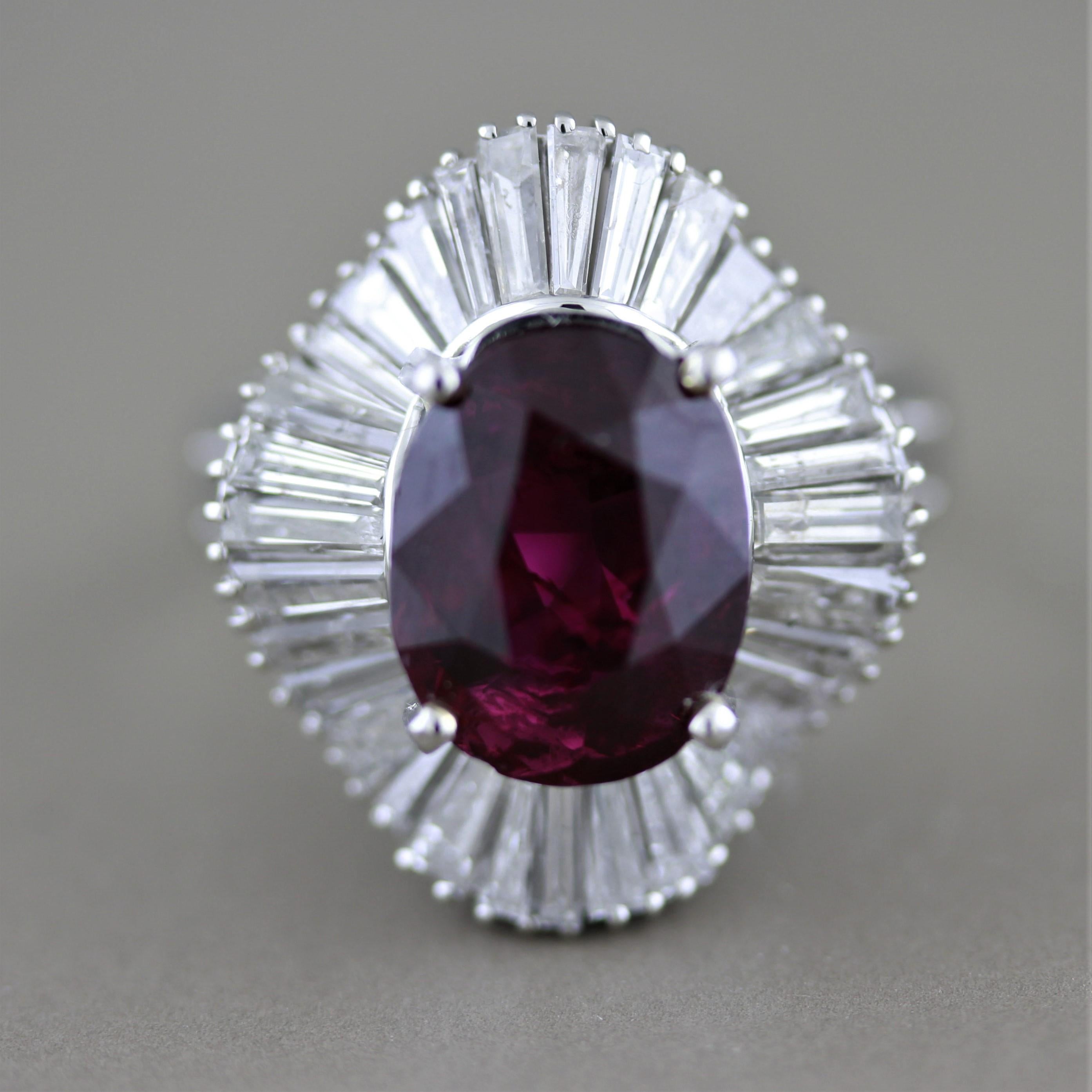 Here we have a magnificent tourmaline with a vivid ruby like red color giving it the variety name Rubellite. It weighs 4.92 carats and is cut as a beautiful oval shape with great luster and brilliance. The gem is surrounded by 3.02 carats of