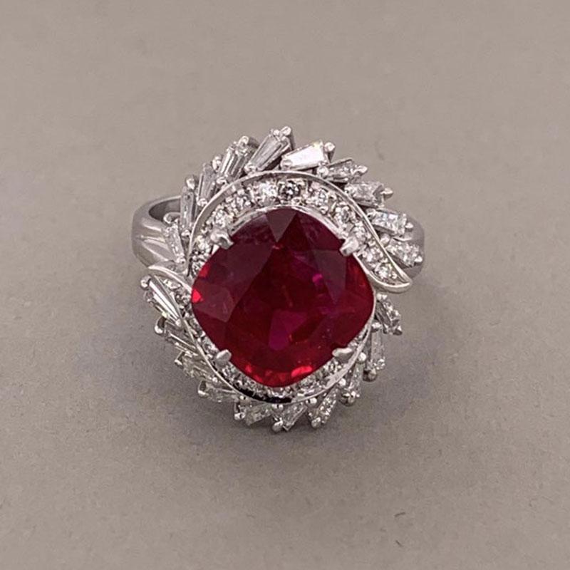 Here we have an exceptional ruby with a deep rich vivid red color that rivals any of the finest rubies on the market today. It weights 3.74 carats and is certified by the AGL in New York as a natural ruby cut as a square cushion. It is accented by