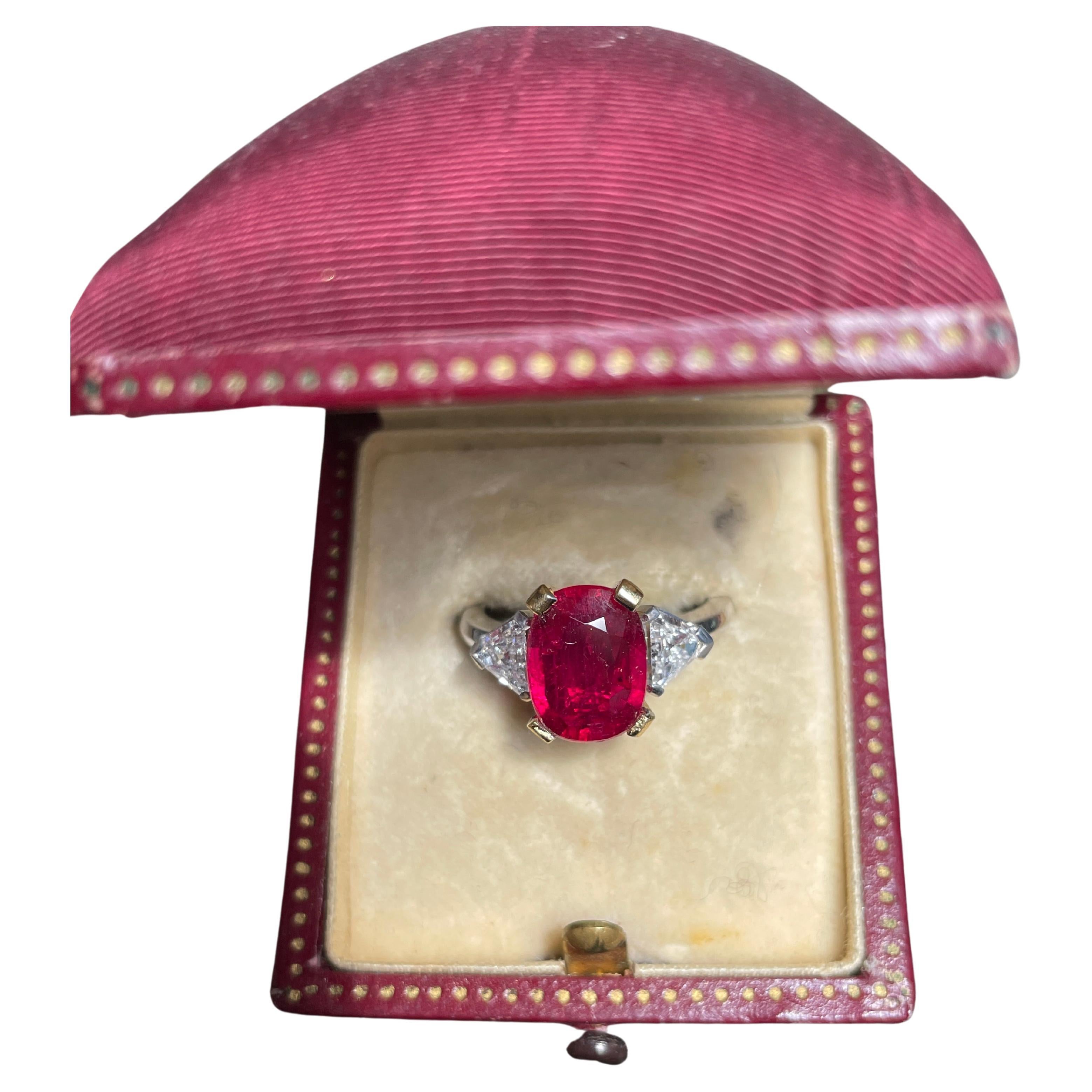 GEM quality 3,21 ct Ruby setted in a Platinum and Yellow hand crafted in Italy mounting, surrounded by 2 white diamond triangles 
The stone is VIVID RED Pigeon Blood Type, very clean and brilliant, nice spready stone figures 4+ cts
This is a Top