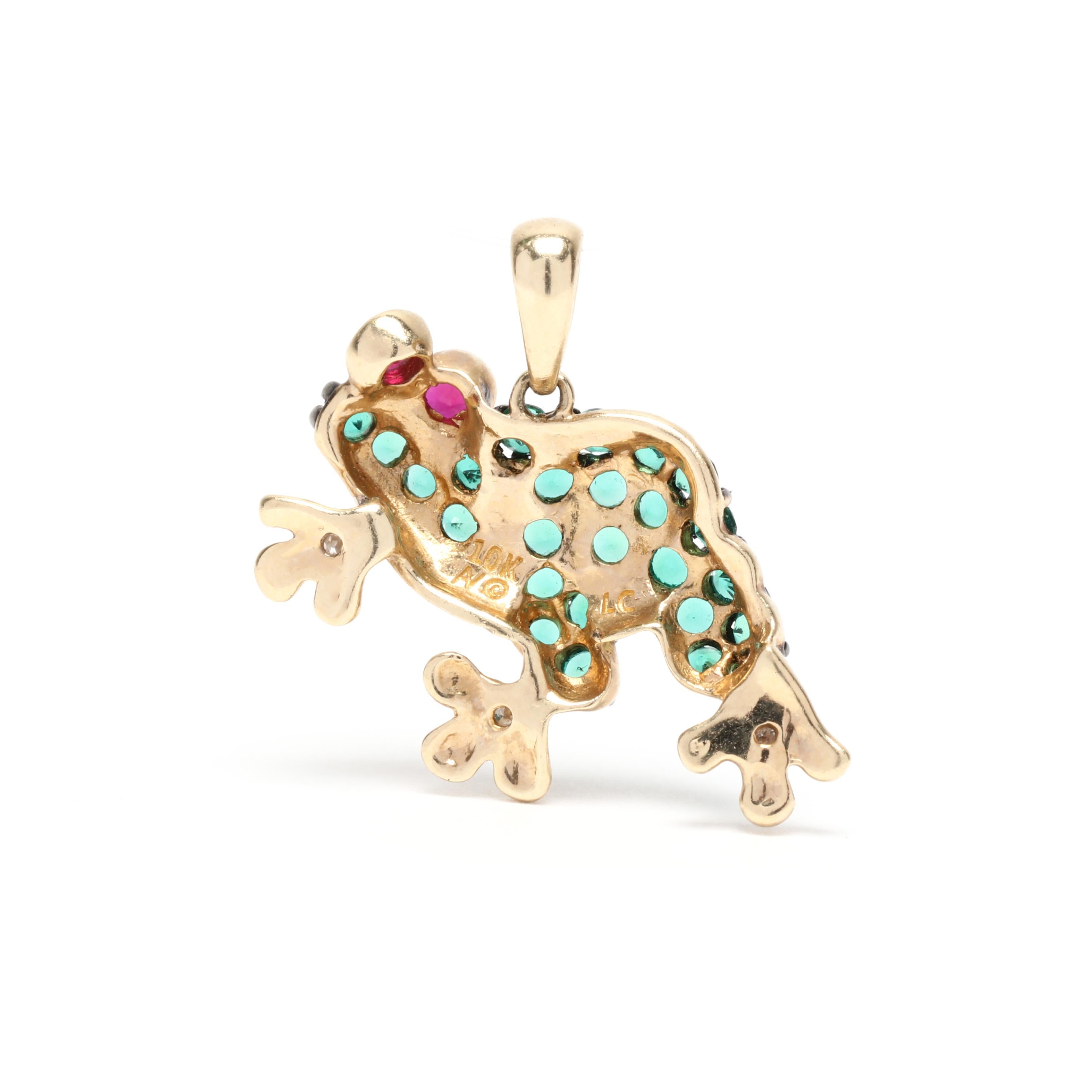 A vintage 10 karat yellow gold and gem-set frog charm. This charm features a small frog motif set with round cut green cubic zirconias on the body, bezel set red cubic zirconias for eyes and diamond melee accents on its feet.

Length: 11/16