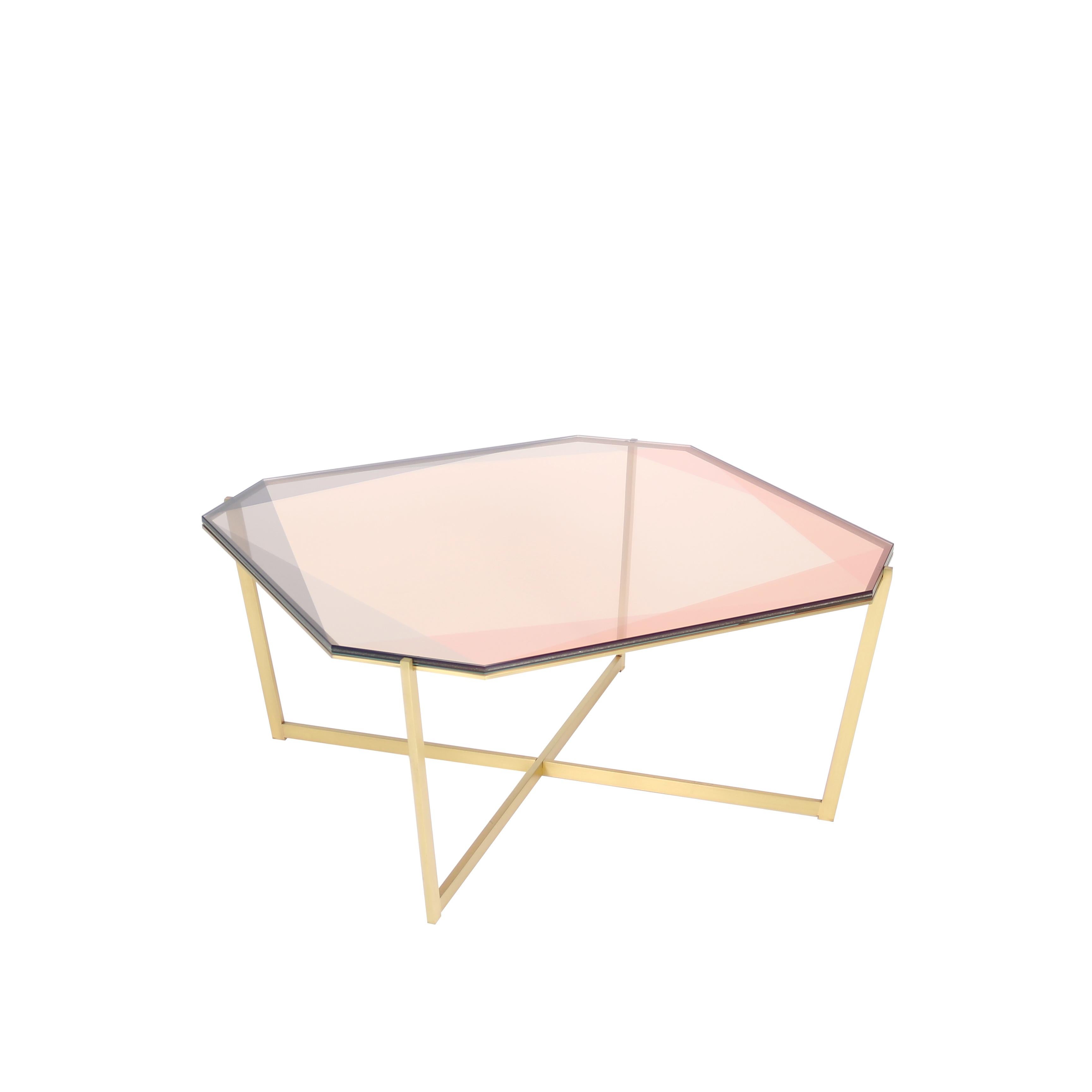 Our Gem collection of tables are inspired by the reflections of light and transparencies found in gemstones. These metal and glass tables translate facets through layers of color and varying opacity. Each table base is designed as a setting with