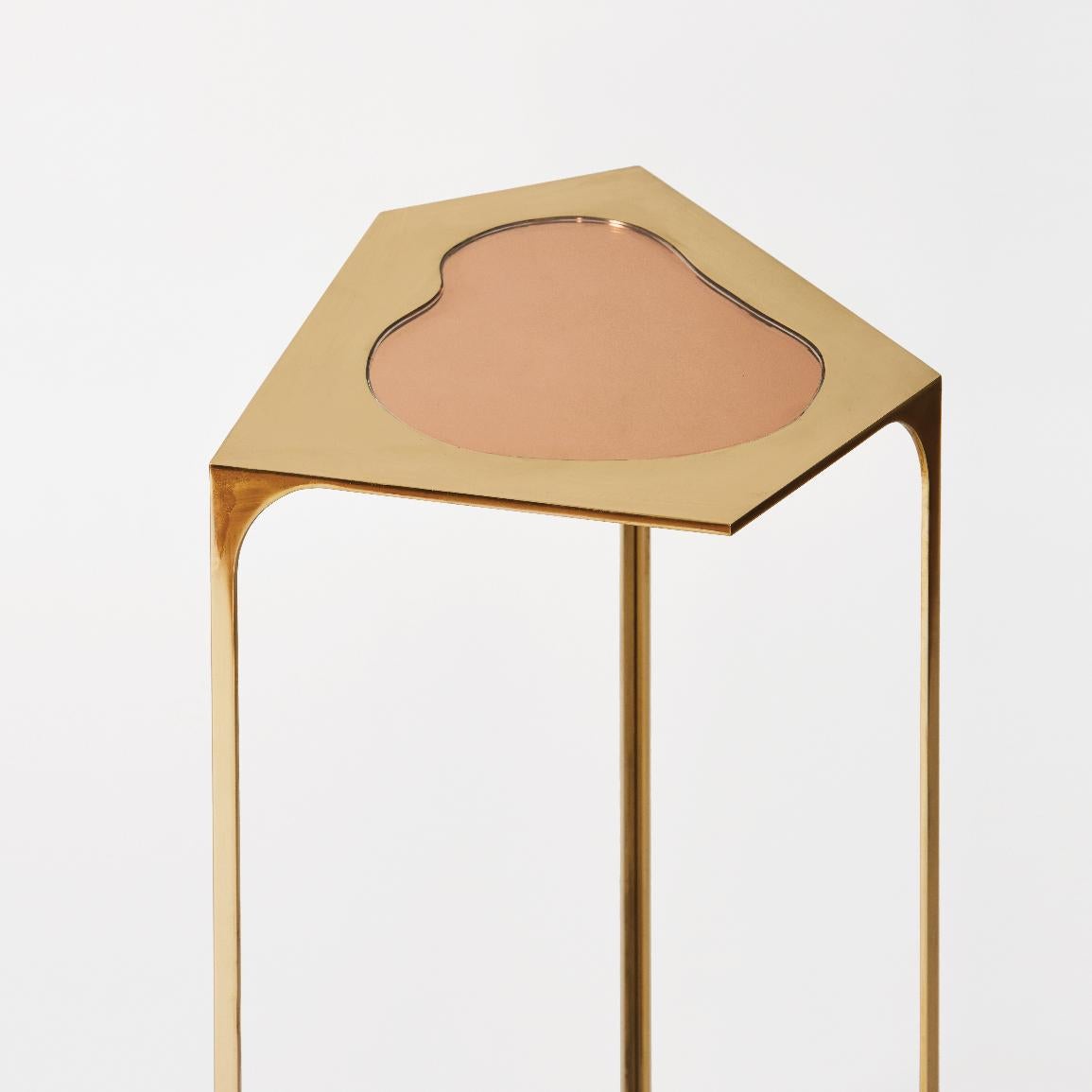Gem table in peach mirror and brass by Cam Crockford 

Materials: Brass, peach mirror
Dimensions: 13 W x 12 D x 17 H inches.