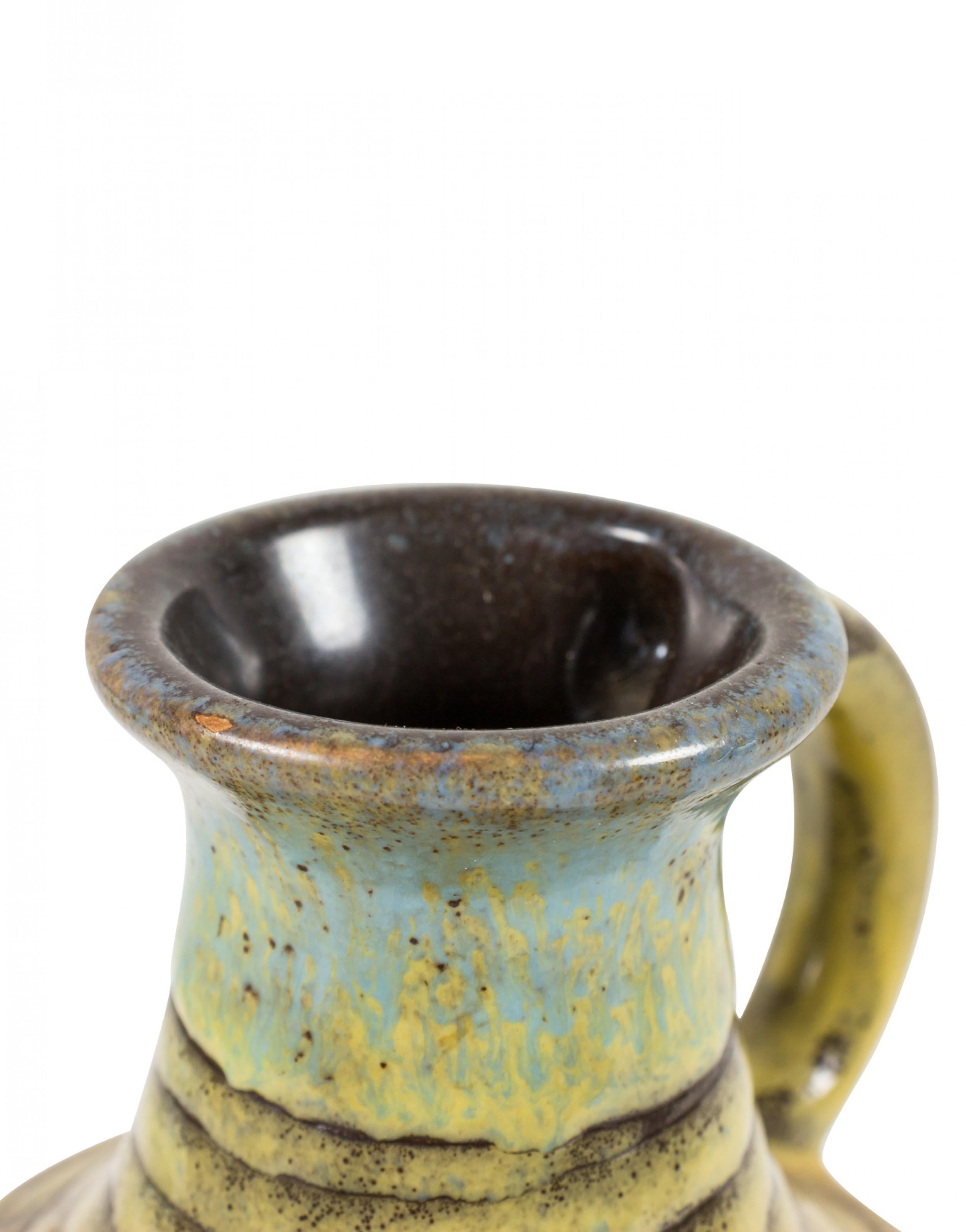 German mid-century ceramic handled jug with a raised 