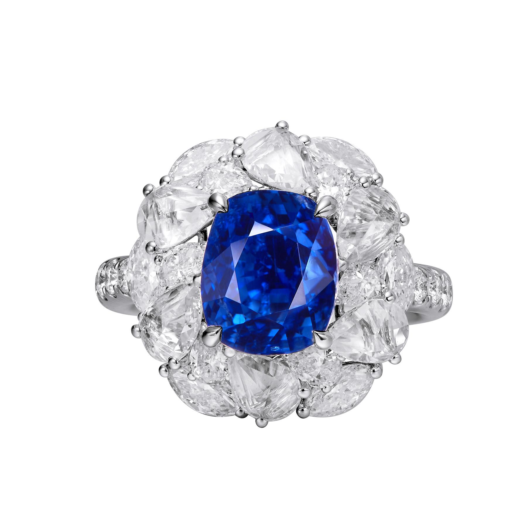 This GEMCOOK JEWELLERY 5.12ct Burmese Royal Blue Sapphire Ring features a stunning 5.12ct Burmese royal blue sapphire. Crafted with expert precision, this ring is a true testament to fine jewelry. Add a touch of luxury and sophistication to any