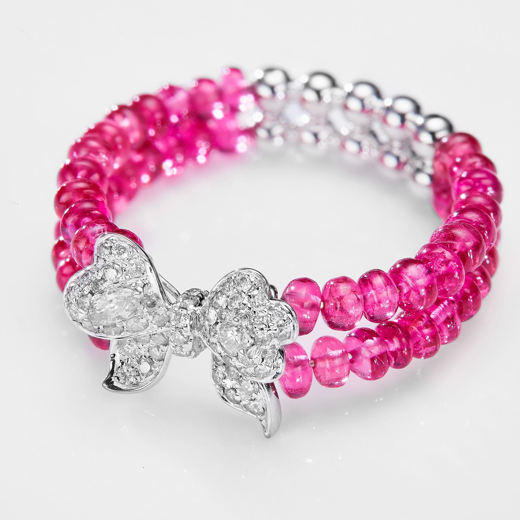 The GEMCOOK JEWELRY Bow Beaded Spinel Ring is expertly crafted with a delicate bow design and intricate beaded detailing. Made with high-quality spinel, this ring adds a touch of elegance to any outfit. Perfect for those who appreciate timeless and