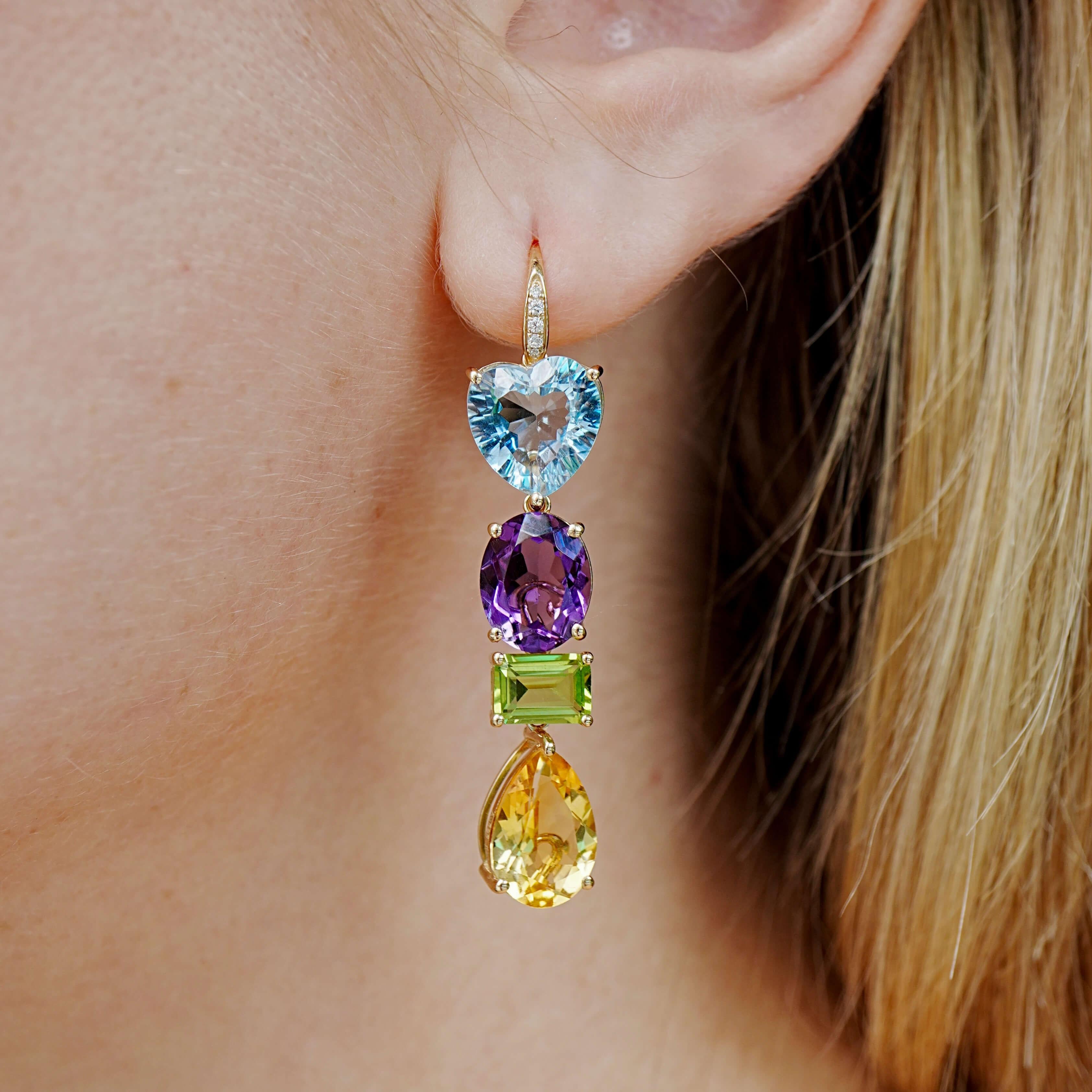 A joyful explosion of color, form, and creative freedom—this design is part of our GemFusion series, where elements can be detached, rearranged, or worn solo. This pair brings together a heart-cut sky blue topaz, oval amethyst, emerald-cut peridot,