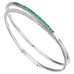 Gemistry 0.65cttw. Emerald and Diamond Rolling Bangle in 18k White Gold